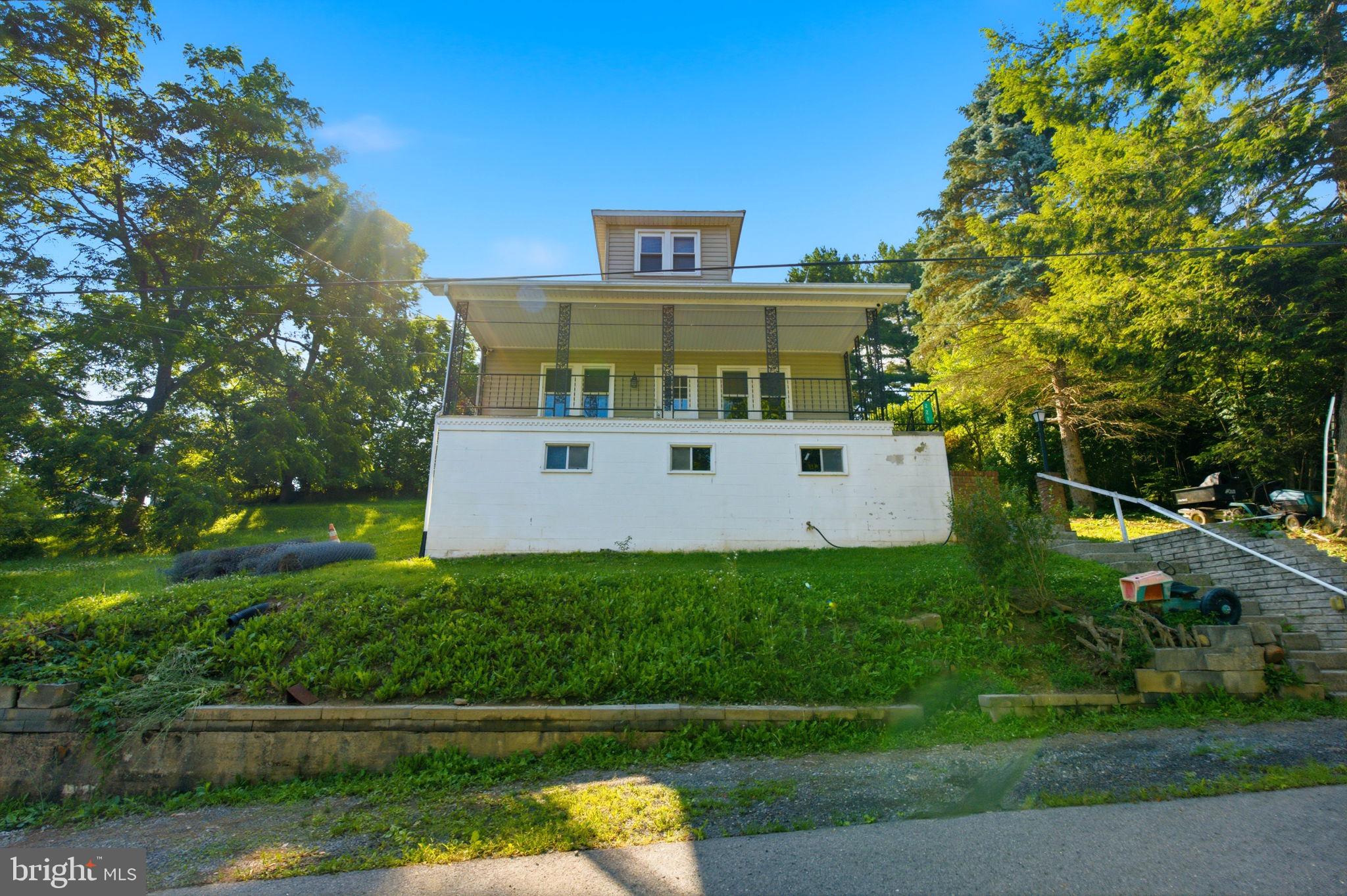 Discover this charming Colonial in the heart of Hancock offering a warm blend of character, updates, and small‑town appeal. This 3-bedroom, 2‑full‑bath home features 1,365 sq ft of finished living space above grade, newer flooring throughout, fresh paint, and an updated kitchen complete with granite countertops and newer appliances. The bright and comfortable layout includes spacious living areas and a walk‑out unfinished basement that provides excellent storage or potential for future expansion. Enjoy picturesque views and a private setting while still being just minutes from I‑70, the C&O Canal, and local amenities. The home sits on a manageable 0.14‑acre lot with public water and sewer, central A/C, and oil heat. Washer and dryer convey and are newer, adding to the move‑in‑ready convenience. Perfect for first‑time buyers, downsizers, or anyone seeking an affordable detached home with updates and charm in a peaceful location.