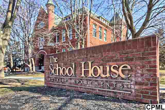 Gorgeous 1BR 1 BA main level condo in the sought after Schoolhouse building! Open floor plan  with 12' high ceilings. Covered parking spot, secure entrance, water, sewer, trash exterior maintenance, multiple interior / exterior finished common areas, mail area AND fitness center included. Conveniently located within walking distance of all that Mechanicsburg Borough has to offer! Don't let this rare opportunity pass you by- call today!   Home can be used as an income rental.