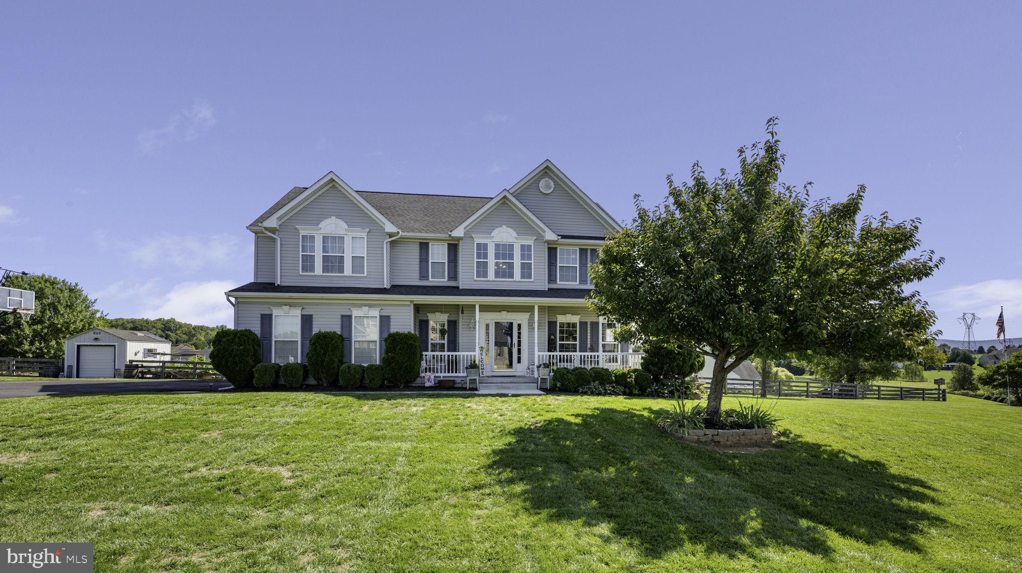 Reduced $50K for a quick sale!  Welcome to 107 Spruce Hill Way, a stunning property that effortlessly combines elegance and comfort in the serene setting of Charles Town, WV. Nestled on a generous 1.43-acre lot, this exquisite home offers an exceptional living experience with a wealth of luxurious amenities and thoughtful updates.

Upon arrival, you'll immediately notice the striking curb appeal of this residence, featuring a freshly recoated asphalt driveway leading to a spacious side-load garage. The meticulously landscaped grounds are complemented by a beautifully fenced yard, ensuring both privacy and security.

Step inside to discover a grand foyer that sets the tone for the rest of this exquisite home. With four spacious bedrooms and three and a half bathrooms, this residence provides ample space for both relaxation and entertainment. The heart of the home is undoubtedly the gourmet kitchen, a culinary enthusiast's dream. Outfitted with 42-inch cabinets, sleek granite countertops, and high-end stainless steel appliances, this kitchen is as functional as it is stylish. The adjacent morning room addition offers a sunlit space perfect for casual dining or enjoying your morning coffee.

The open layout continues into the expansive family room, where you'll find an inviting atmosphere enhanced by a modern design. For more formal gatherings, the elegant dining room provides a sophisticated setting. Step through French doors to the large deck off the kitchen, a fantastic spot for outdoor dining and entertaining.

Venture outside to the backyard oasis, where a large brick patio, a serene koi pond, and a beautifully maintained Fiberglass lined inground pool with an adjacent jacuzzi await. This private retreat is further enhanced by a charming screened-in porch and a cozy veranda, perfect for relaxing and enjoying the tranquil surroundings.