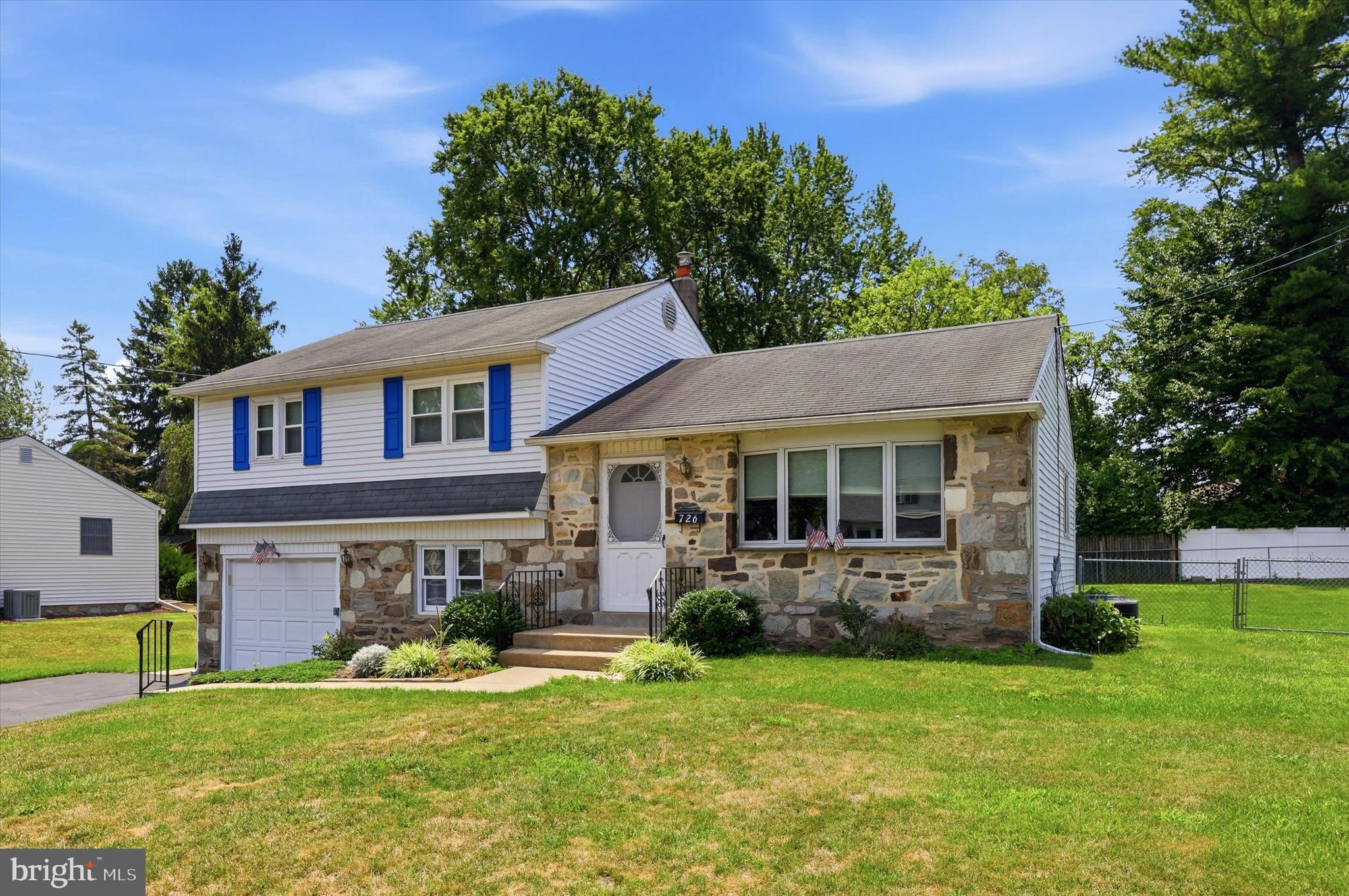 Charming split-level home with fantastic curb appeal. Welcome home to this lovely split-level, boasting a classic stone front and one car garage. Step inside to a large living room featuring a bay window allowing the natural light to pour in. The separate formal dining room is perfect for entertaining. The eat-in kitchen offers gas cooking, and plenty of cabinet and counter space. The lower level family room provides additional living space along with convenient garage access, plus the laundry and utility area. From the laundry room, step out to a lovely covered patio overlooking the spacious backyard which makes it ideal for relaxing or entertaining outdoors. Upstairs you'll find three generously sized bedrooms, each with ample closet space, along with a full hall bath. The fully fenced yard includes a nice sized shed for your outdoor storage needs. Situated in a wonderful neighborhood which is close to parks, public transportation, and major roads and highway. This home offers both comfort and convenience. Schedule your showing today!