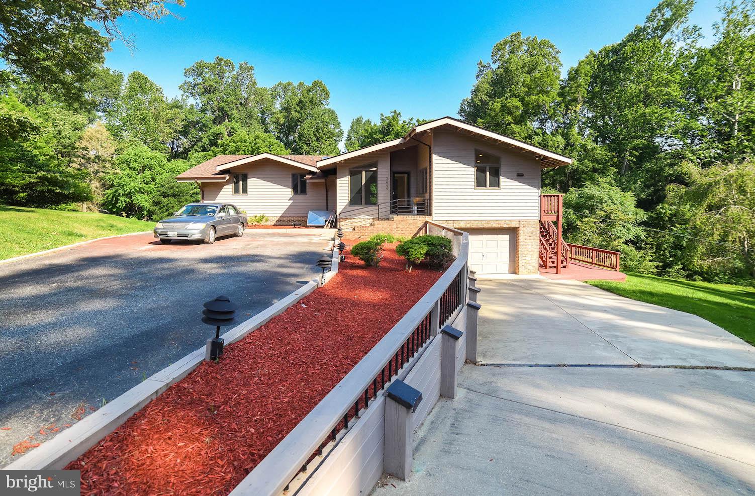 Don't miss your chance to become part of this exclusive established community of Scientist's Cliffs.  The well-lit entrance to this secluded gem shows off plenty of room inside and out and offers a private beach for your pleasure.  A large master with private bath and two large bedrooms are all on the main level.  The family room opens to a screened porch that wraps around to the kitchen entrance.  In the kitchen, there's room for plenty of family time in the eat-in area, which leads to a nice size dining room for more formal events.  The nearly completely finished lower level features a wood stove and plenty of room for all of your hobbies, including a good size workshop.  A separate laundry opens to a good size garage. Outdoor options include tennis, boating, swimming (in the Bay or a community pool) and a very quiet, but active neighborhood.  New roof in 2019.  Fresh paint throughout!  HOME WARRANTY.  (Closet doors are being refinished and will be reinstalled by closing!)