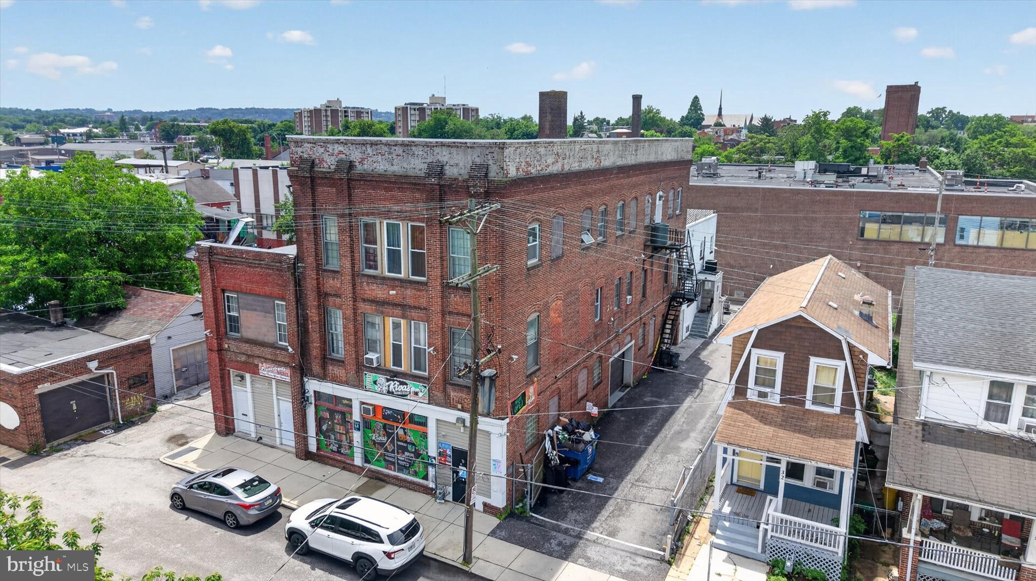 Outstanding income-producing mixed-use 6-unit investment package in York City offering scale, parking, strong income, and upside! This four-parcel sale includes 22 N State Street, 26 N State Street, 527 E Market Rear Street, and 529 E Market Rear Street, featuring multiple residential and a commercial rental space, 14 off-street parking spaces, and a 9.5%+ cap rate. The units are very spacious with impressively high ceilings, giving the property a grand feel and making the rental spaces especially attractive to tenants. All units are currently rented except for one residential unit, allowing the next owner to step into immediate cash flow with additional upside once fully occupied. With over 13,000 sq. ft. of building area, more than 15,000 sq. ft. of combined lot area, public utilities, multiple income streams, and a convenient York City location, this is a rare opportunity to acquire a substantial investment property with strong existing performance and room to increase returns. A standout portfolio addition for investors looking for income, size, parking, and long-term upside in one package.