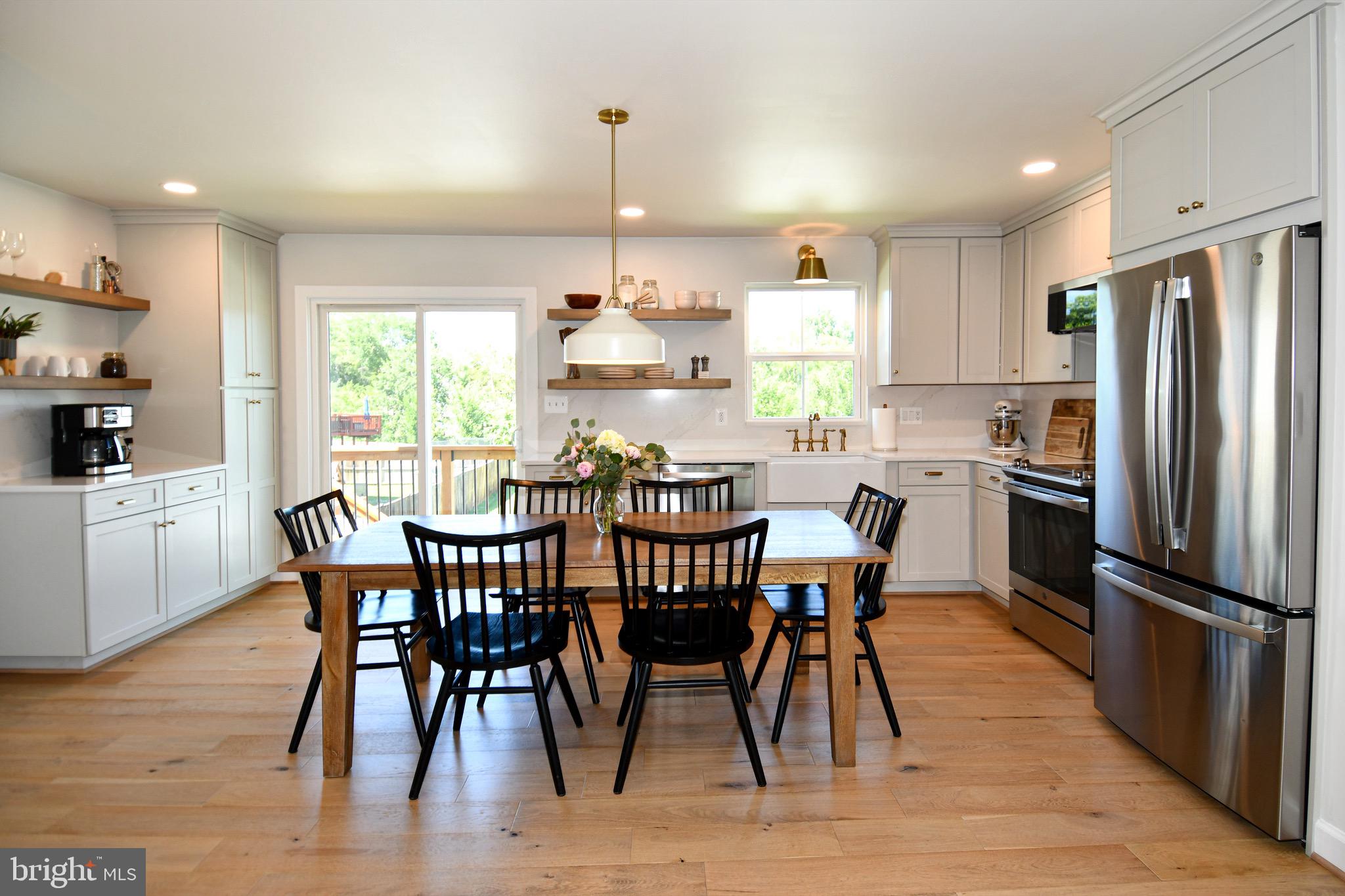 Welcome to this beautifully updated 4-bedroom single-family home in the charming town of Remington, where small-town living meets modern comfort. Just a short walk to downtown Remington and the Rappahannock River, this move-in ready home offers the perfect blend of style, space, and convenience in a highly sought after modern contemporary farmhouse style that blends timeless warmth with clean, current design. Truly nothing you need to do but move in!   An amazing feature of the property is the large, long, and wide driveway, offering exceptional parking space for multiple vehicles, guests, and recreational use!   The heart of the home is the stunning kitchen, completely remodeled in 2023 with custom plywood cabinetry, gorgeous Silestone quartz countertops and waterfall backsplash, a farmhouse sink, recessed lighting, hardwood flooring, and stainless steel appliances. The open-concept main level flows seamlessly between the kitchen, dining, and family room, creating a bright and inviting space ideal for both everyday living and elevated entertaining. Additional recessed lighting throughout the main level enhances the modern contemporary farmhouse feel, balancing warmth with a clean and sophisticated aesthetic.   Throughout the home, you will find numerous upgrades including fresh paint, updated light fixtures, new trim, hardwood flooring on the main level, and an updated half bath. New window panes were installed throughout the home in 2025/2026, enhancing both energy efficiency and natural light while adding to the home’s refined curb appeal.   Upstairs features four spacious bedrooms along with the convenience of upper level laundry equipped with a front loading washer and dryer and additional soft close storage cabinets.   The newly finished basement, completed in 2025, adds valuable living space with recessed lighting, brand new amazing soft carpeting, and a storage closet. Whether used as a recreation room, home office, gym, playroom, or guest suite, this flexible space offers exceptional versatility and value.   Step outside and enjoy your private large and flat backyard retreat. The fully fenced yard provides ample space for pets, gardening, and outdoor gatherings. In addition there is open common area space directly behind the fence for more privacy and/or recreation!  A spacious rear deck built in 2024 and a beautifully designed patio create an ideal setting for relaxing or entertaining in a private, peaceful environment.   Additional highlights include a two car garage, water treatment system, and extensive thoughtful upgrades throughout the home. *New sump pump June 2026.  This beautifully maintained and tastefully upgraded home stands apart, offering generous indoor/outdoor living spaces, a rare combination of features that are difficult to find in today’s market! Immaculate and very well taken care of. A large driveway, premium finishes, and an exceptional location in the heart of Remington make this an opportunity not to be missed!