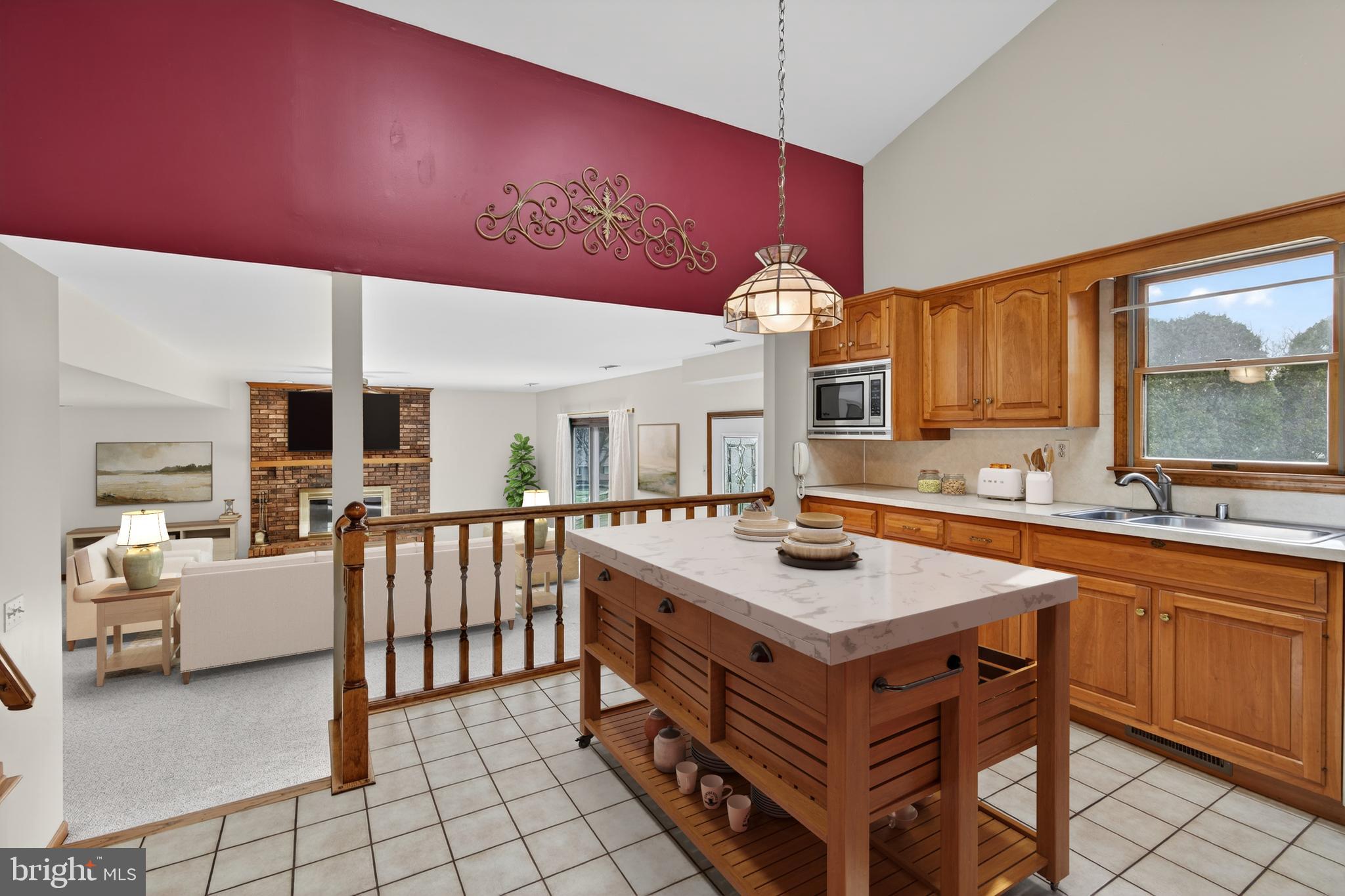Custom built split-level home in a highly sought after Fallston neighborhood, proudly maintained by its original owners. This spacious home features a bright, open main level with a living and dining room highlighted by soaring cathedral ceilings. The kitchen, also with a cathedral ceiling and two skylights, overlooks a spacious family room complete with a fireplace and walk-out access to the patio and backyard—perfect for everyday living and entertaining. This lower level also includes a 4th bedroom, half bath, and laundry room, offering flexible living options. Upstairs, you’ll find 3 generously sized bedrooms and 2 full bathrooms. A second lower level provides additional space,  utility room, and access to the oversized 2+ car garage with electric and ample storage. Situated on a .58-acre lot, this home offers approximately 3,960 total square feet, with 2,380 finished square feet. NO HOA! Welcome Home!