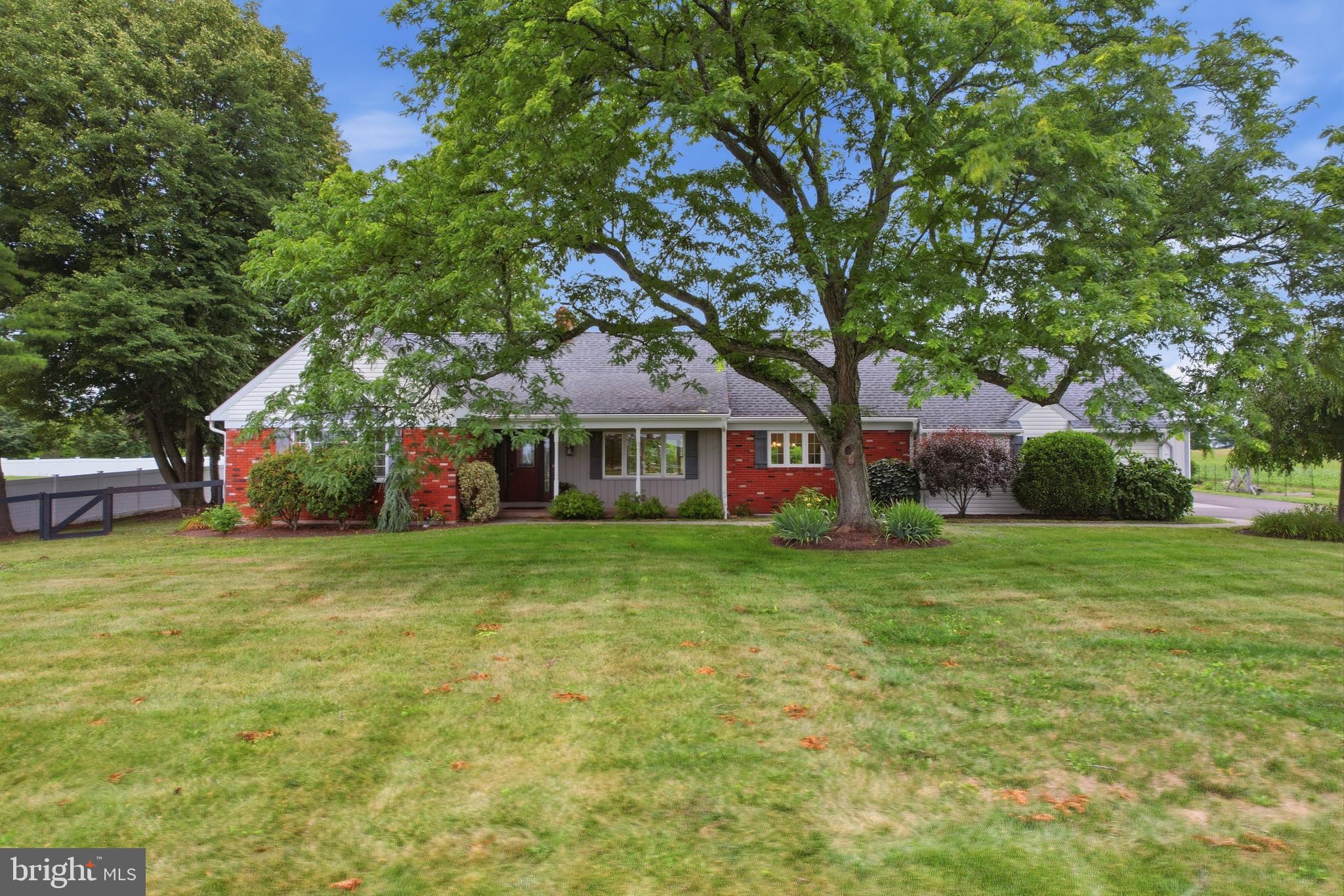 Escape to your own quiet paradise with this meticulously maintained, beautifully upgraded 4-bedroom, 2-bathroom Souderton home. Perfectly blending the easy flow of a rancher with the timeless charm of a Cape Cod, this nearly 3,000-square-foot residence sits on a premium, ultra-private 0.93-acre lot. Enjoy breathtaking, panoramic views and serene tranquility from every angle. Inside, pride of ownership shines through a modern kitchen, fully updated bathrooms, and a living room anchored by custom built-in bookcases and cozy gas logs. The fully finished basement adds massive functional living space, plus a separate area providing tons of additional storage. Step through elegant new French doors to your private, fully fenced backyard—complete with a brand-new patio ideal for outdoor entertaining. A true standout feature for hobbyists, contractors, or car enthusiasts is the detached, two-car pole barn featuring an oversized workshop. With major mechanical updates including a new heat pump and hot water heater, this stunning, turn-key property offers complete peace of mind.