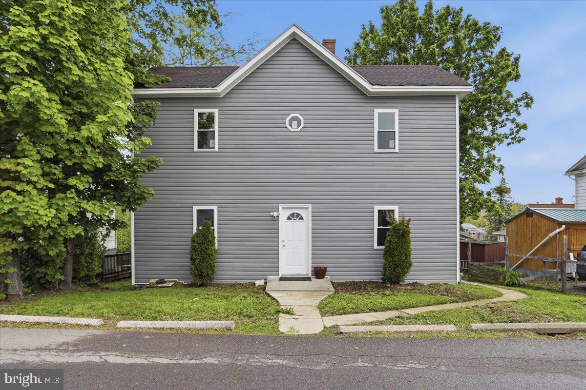 This large home across from the Frostburg State University campus just had a new and beautiful face lift to include all new siding, all new windows throughout, new water line into the home and an updated bathroom!  Along with all of the wonderful upgrades this home also offers a large eat in kitchen, large living room and 4 large bedrooms, to include one on the main level.  Within walking distance to the Frostburg campus and downtown Frostburg where you will find great shopping and restaurants.  Don't miss out on this newly update home that is priced to sell!!  When showing the home please park in the rear yard which is accessed by the alley.