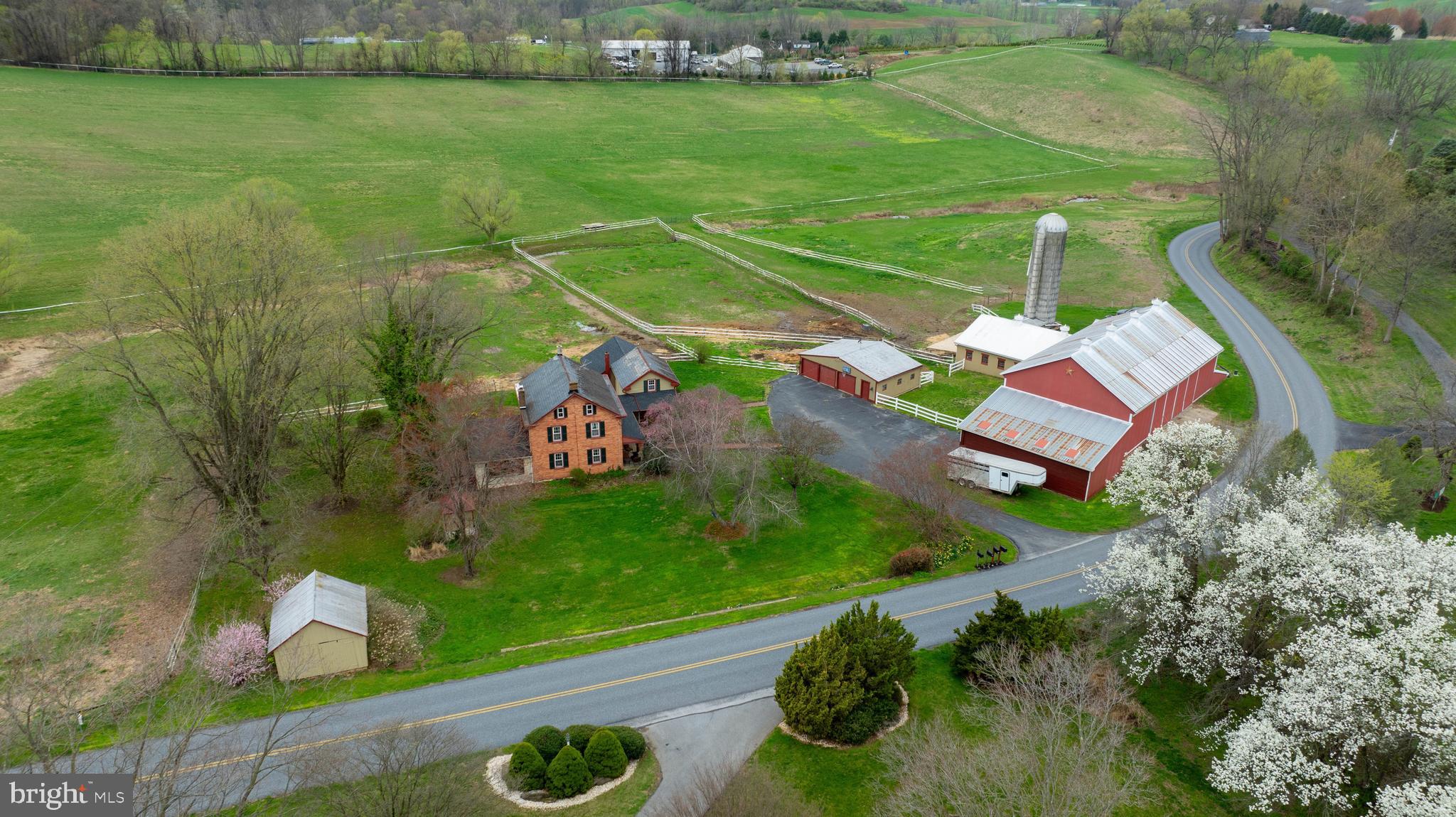 Horse Lover's Dream on 33.8 Acres in Southern Lancaster County!
 Welcome to 287 Smithville Rd. This 33.8-acre property offers everything you need for equestrian living, with a beautifully updated farmhouse and a host of outbuildings.
The primary residence features three bedrooms and 1.5 baths, including a custom cherry kitchen with granite countertops stainless steel appliances, including a new gas range. Exposed wood beams, yellow pine hardwood floors, and a stone wood-burning fireplace add warmth and character to the bright family room. Upstairs, you'll find a recently renovated full bath with a clawfoot tub.
An additional 1,172 +/- sq ft home is connected by a covered porch. It offers two bedrooms and two full baths—one bedroom and bath conveniently located on the first floor. This flexible space is ideal for extended family, guests, or potential long—or short-term rental income (check with the township for zoning and use).
Equestrian facilities include a bank barn with 9+ large box stalls, four standing stalls, one foaling stall,  and an upper level for hay and equipment storage. Additional outbuildings include a 3-car detached garage with electricity, an original smokehouse, a run-in shed, and more.
There are two 10-acre pastures and 10 acres for hay, including an area for polo practice.   A spring-fed creek flows through the pastures, adding a convenient water source for livestock. The entire property is fenced in. 
This property is also enrolled in Lancaster County's Clean and Green program, helping reduce property taxes.
Whether you're looking for a working farm, a peaceful retreat, or a multi-use property with rental potential, this unique farm offers endless possibilities. Schedule your private showing today!