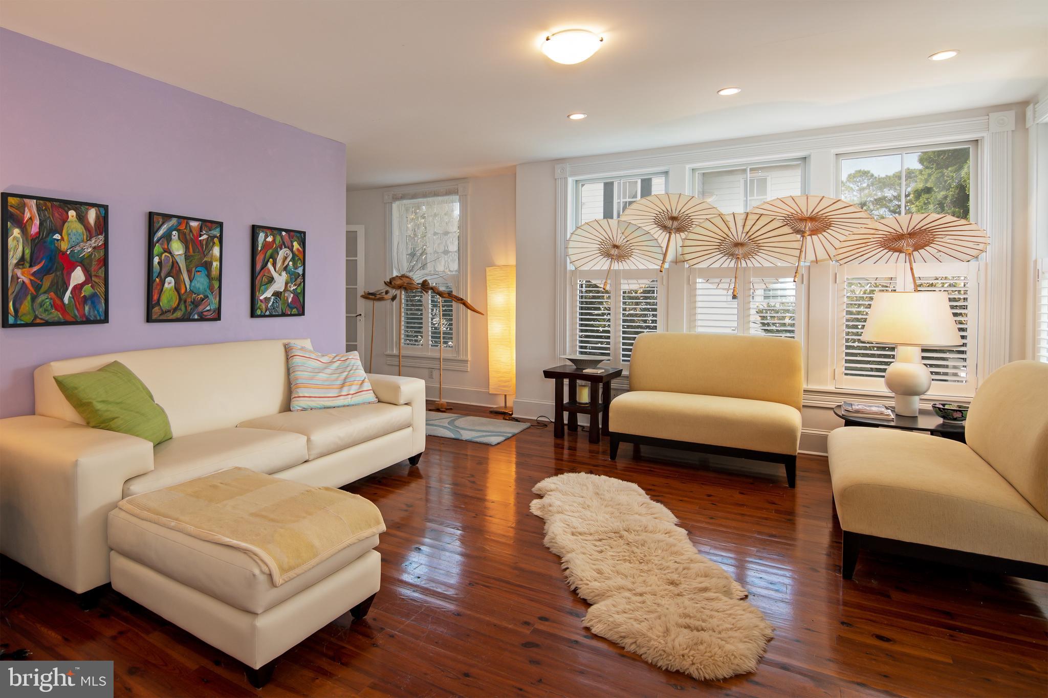 9 West  End Avenue - a perfect blend of sophistication and tranquility.  #9 is proudly sited on the corner of West End Avenue and Hambrooks Blvd...just 5 houses from the banks of the mighty Choptank River!  Now  is the perfect time to host an upstairs porch party with views of the beautiful river. 

 # 9 has been quietly owned by a professional couple from DC for almost 20 years.  You can see the subtle city influence in various details of every room, but, more importantly,  you can glimpse the wife's artistic attention to minute details throughout this charming haven.

Charles Goebel, a highly-respected Easton architect designed the renovations and additions.  The work was flawlessly executed by esteemed  Cambridge builder Thom Huntington.  The renovations included a new Living Room, a glamorous first-floor bathroom, and generously-sized porches on the first floor, covered by a gull-winged roof. The outstanding spacious kitchen features a multitude of light sources, a top-of-the-line propane range with hood, a built-in microwave drawer, and beautiful Carrara marble countertops and backsplash.  A pass-through bar area to the dining room provides a great casual seating arrangement in addition to the formal dining room.   

The upstairs second floor offers 3 bedrooms and a full bath but the most captivating aspect of the 2nd floor is the beautiful balcony off the central hall.  The balcony has views of the river and the beautifully landscaped garden. In total, there are 4 outdoor porches and balconies. The back garden is an amazing oasis of specimen plantings and magnificent trees.  The well-placed potting shed makes gardening a delight. The front porch's trompe l'oeil floor and sky ceiling were designed and painted by Mike Rosato,  a locally acclaimed artist whose work can be found throughout the city and in numerous museums throughout the country. 
#9 West End's location is ideal for strolling to the Farmers Market or the  Cambridge Yacht Club and is just a short walk to all of the downtown restaurants, galleries, and shops.   The renaissance in Cambridge is alive and flourishing.  Please call Mary for additional details and a tour today!