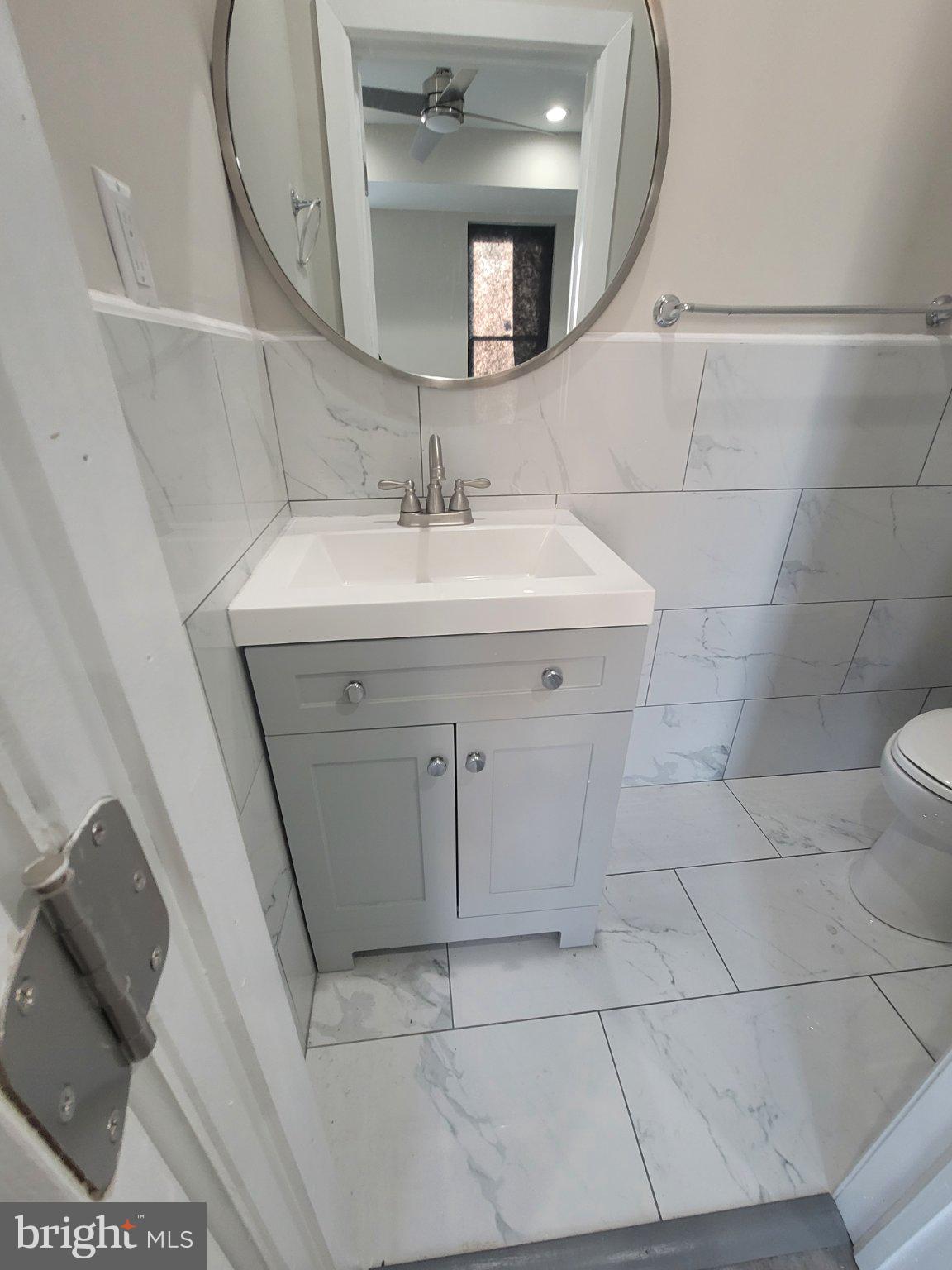 Stunning 3BR End-Row Townhouse in vibrant West Philly awaits you! This fully remodeled over 1400 square feet gem boasts a 4th large bonus room  in the basement with a full bath, ideal as an office, guest room or den.   The other 3 bedrooms are spacious as well.  With a 'just completed' renovation, it includes thoughtful upgrades that meet modern needs like crisp 2.5 baths, state-of-the-art appliances, and a spacious 21-handle kitchen offering ample storage. Enjoy the deck that can be setup to sit and relax or enjoy outdoor barbeques.  The home features Bluetooth speaker wiring throughout for enjoying your favorite tunes anywhere indoors. Topped with an all-new roof, this dwelling provides not only style but peace of mind. Don't miss this opportunity to own an immaculately updated property ready for immediate move-in!