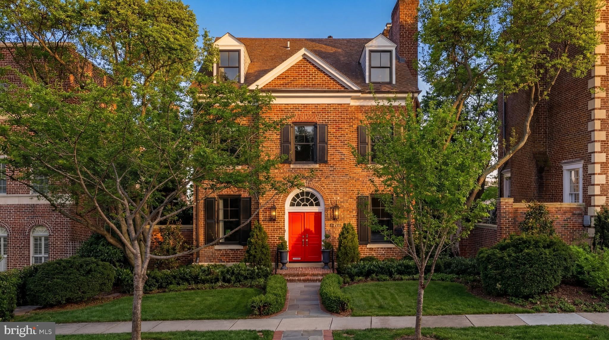 A showcase of leading-edge design and exceptional craftsmanship in one of Washington's most desirable neighborhoods,  4608 Kenmore Drive NW exemplifies refined luxury living. Despite its stature as a sprawling five-level residence, the home’s curb appeal conveys warmth and familiarity. A central flagstone walkway leads to a restrained, symmetrical façade highlighted by bright red double doors beneath an arched transom window, framed by rich black shutters and charming dormers.

Inside, a formal reception area introduces interiors that have been meticulously upgraded to a magazine-worthy standard, showcasing exceptional materials and workmanship throughout. Refinished white oak flooring establishes a fresh, neutral palette across the home. On the main level, a private office is discreetly tucked away, featuring built-in shelving, a fireplace, and a convenient wet bar. The spectacular formal living room spans the full 28-foot width of the home, anchored by a fireplace and illuminated by two sets of French doors that open onto Juliet balconies overlooking the rear grounds.

An elegantly curved grand staircase connects all levels of the residence and is complemented by a private elevator. One level below, the home’s casual living space centers around a chef’s kitchen appointed with elegant cabinetry, marble countertops, and a striking contrasting island with integrated seating. A full Thermador appliance suite completes the space. The kitchen flows seamlessly into the adjoining family room, and both areas open onto a full-width terrace that blurs the lines between indoor and outdoor living.

The upper level is dedicated entirely to a lavish primary suite. The dressing room is a functional work of art, occupying half of the floor plan and featuring a center island, fully concealed custom built-ins, and a thoughtfully designed footwear gallery. Equally luxurious, the primary bath offers a freestanding soaking tub with sweeping views, a double marble vanity, herringbone tile flooring, and a spacious glass walk-in shower.

The top level includes a private sitting area and three additional bedrooms, one ensuite and two connected by a Jack-and-Jill bath. From this level, the home enjoys sweeping views toward the gleaming Rosslyn skyline.

The lower level features laundry facilities and a generously proportioned recreation room that opens directly to the home’s enchanting outdoor space. Fully walled for privacy, the grounds center around a substantial saltwater lap pool clad in radiant mosaic tile and equipped with new mechanical systems, an exceptionally rare amenity in an urban setting. The surrounding flagstone patio includes a spa, while a separate side terrace offers a more intimate outdoor retreat. Above the detached two-car garage, accessible from the rear alley, an elevated deck provides space for both al fresco lounging and dining.

Outdoor living is further enhanced by a full surround sound system and an extensive landscape lighting package. The home has also benefited from major infrastructure upgrades, including new HVAC systems, Lutron lighting controls, Lorex video surveillance, ADT security, and UV-reflective windows protected with 3M film.

Ideally situated between Berkley and Georgetown, the location offers convenient access to neighborhood shops, restaurants, and some of Washington’s most sought-after residential enclaves.

Blending exceptional design, modern amenities, and an outstanding location, 4608 Kenmore Drive NW stands as a rare offering in Washington.