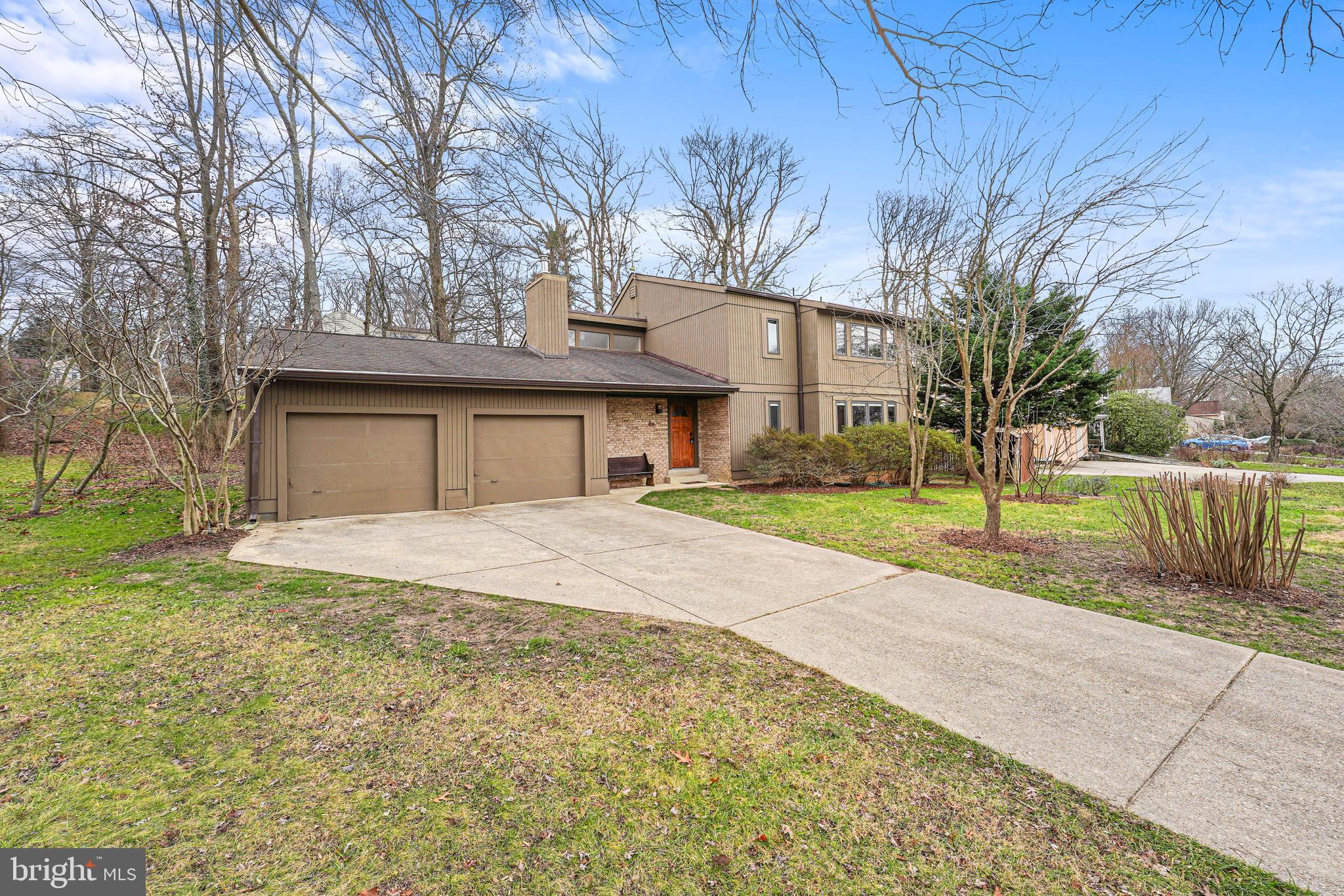 OFFER DEADLINE TUESDAY (1/9) AT NOON!  Do you like contemporary home motifs with a vaulted sky-lighted living room, a combination of cherrywood and Berber wool carpeted flooring, surrounded by hardwood trees, fruit trees, and vegetable beds?  Then this green haven in the popular Stonegate neighborhood, about a 12-minute drive to the Glenmont metro station, and a short walk to the community pool down the street, is for you.  Fruit trees include two fig varieties, sour cherry, apple, jujube, pawpaw, black currant, and mulberry (check them out when you visit, they have identifying signs for the winter).  The deck has been expanded to include an Italian-style wood-burning pizza oven.

A vaulted ceiling with high windows lights up the living room.  The staircase leading from the first floor to the second floor is hand-laid cherrywood and the fireplace has been converted to a wood-burning, eco-friendly stove surrounded by bricks and hand fashioned stoneware for a supplementary heating source and social gathering place.  All the windows in the house and the sliding doors leading to the outdoor deck from the dining room and the kitchen are double-paned and wood-framed.  The kitchen features a granite countertop and stainless steel appliances.  The finished basement includes a handmade desk and bookshelf and Berber carpeting.  The two full-bathroom shower tiles are fashioned from hand-laid travertine.  

The home features an attached two-car garage with electric garage door openers and a loft for extra storage.  The crawl space is fully enclosed by a vapor barrier.  The initial pool membership fee transfers from the current to the new owners.  Within walking distance to the home is Stonegate Elementary, newly built and in its first year of operation in a beautiful new building, and Stonegate Community park, playground, and tennis courts.