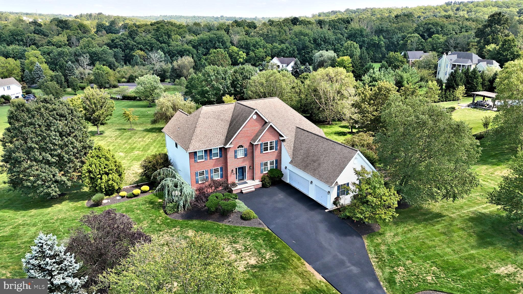 Located in one of Northampton Township s most sought after communities sits the spectacular and spacious custom built home. Situated perfectly on a gorgeous 2 acre parcel, this fabulous property is being offered for the very first time, and has been lovingly maintained and upgraded both inside and out. The classic brick front is timeless and beckons you from the moment you arrive.  Entering to an open two story foyer you will be greeted by gleaming hardwood floors. To the left is the elegant formal living room,  to the right the formal dining room.  A two story family room with brick surround gas fireplace is directly off the gourmet kitchen and large breakfast area. The kitchen has been updated with stainless steel appliances ( 2024 ), has a center island with seating for 4, two great pantries, work station, and convenient back staircase.  Off the breakfast area is a large 30' x 17' maintenance free deck with gorgeous long distance views.  A home office/library,  spacious mud room, laundry room and powder room complete the main floor.  The upper level features a spacious and elegant Primary Suite, with large sitting room, two nicely sized walk- in closets. The luxurious Primary Bath is outfitted with gleaming white tile,  has a large soaking tub, double vanity and large linen closet. Three additional bright and airy bedrooms, all with spacious closets, flank the large upper hall and complete the upper level. The huge finished lower level features walk out doors to the spectacular paver patio, additional windows providing maximum daylight, gas fireplace with tile surround, entertainment and game areas, and large bedroom with full bath. There is also ample unfinished storage space. The grounds, impeccable landscaping, and exterior features are icing on the cake for this inviting property.  Additional features of this wonderful home include a 3 car garage, new asphalt driveway, whole house backup generator, 2 zone HVAC ( new in 2023),  newer windows and doors, newer roof, security system,  and much more. Worthington Mill Estates is an exclusive, beautiful, quiet community of just 22 custom homes, with no HOA! Located just minutes from Newtown, Richboro, New Hope and Tyler State Park in the heart of the Council Rock School District. This turn-key move-in condition property may be the best new opportunity on the market today; come see for yourself!***Showings start Sunday, September 22 at the Open House Noon - 3:00PM.***