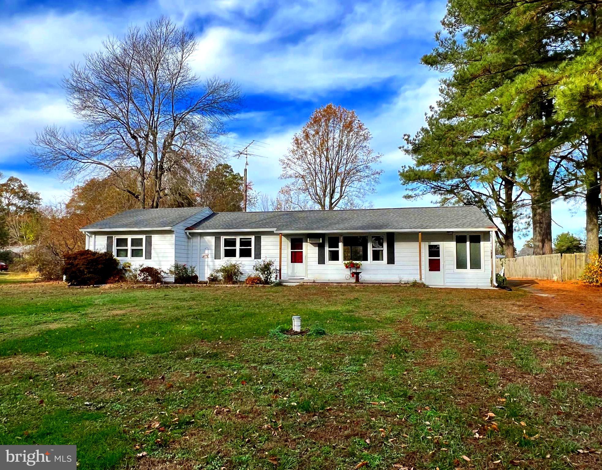Come enjoy the many benefits of quiet, Country Living blended beautifully with the many amenities of close proximity to Historic Downtown Denton.  Welcome home to this larger rancher,  sited on 1.5 +/- acres.   The home has been lovingly maintained from the roof to the crawl space and many areas in-between!  Major updates during 2023  include the  roof,  patio, and front porch as well as carpet and fresh paint. Numerous other updates were made within the last 5 years and include major bedroom and bath renovations. The new owner will also benefit from the  new replacement windows that were installed in most of the home, the heating and cooling that was upgraded to energy efficient ductless heating and air units, and the new tankless hot water heater, electrical panel, and a water softener system that were installed.  The attention to detail doesn't stop within the living space, the  crawl space has been encapsulated  and a dehumidifier was added .  The home has 3 bedrooms, large living room,  separate dining area, a huge storage room/walk in closet and a bonus finished sunroom.  All this home has to offer is situated on the generous parcel just outside of town and the spacious backyard is complimented by two larger sheds and offers plenty of room for gardening and other outdoor activities or just plain relaxing!