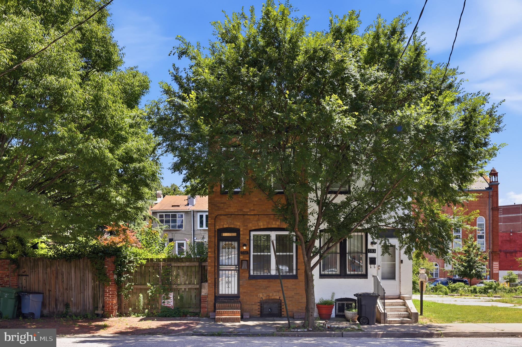 Classic Baltimore brick rowhome nestled in charming Seton Hill, an architecturally intact historic district in downtown Baltimore. This fully renovated 2-bedroom, 1.5-bath home offers approximately 1,040 SQFT of living space with fresh updates, everyday functionality, and timeless city charm. Highly walkable and located right next to St. Mary’s Park, the largest open green space on the west side of downtown Baltimore, the home offers easy access to local amenities, commuter routes, and a vibrant neighborhood setting. The community enjoys yoga gatherings in the park along with other neighborhood events. Inside the home, you’ll find beautiful wood flooring throughout, a spacious living room and dining room, and a convenient main-level half bath. The updated kitchen features white cabinetry and stainless steel appliances! Upstairs offers two bedrooms, a full bath, and a skylight that brings natural light to the bedroom level. The unfinished basement offers excellent storage potential, while the fenced rear yard with wood privacy fencing provides a private outdoor space to relax or entertain. Additional highlights include public parking behind the property, 2019 electric water heater, and an 2017 electric HVAC system.
