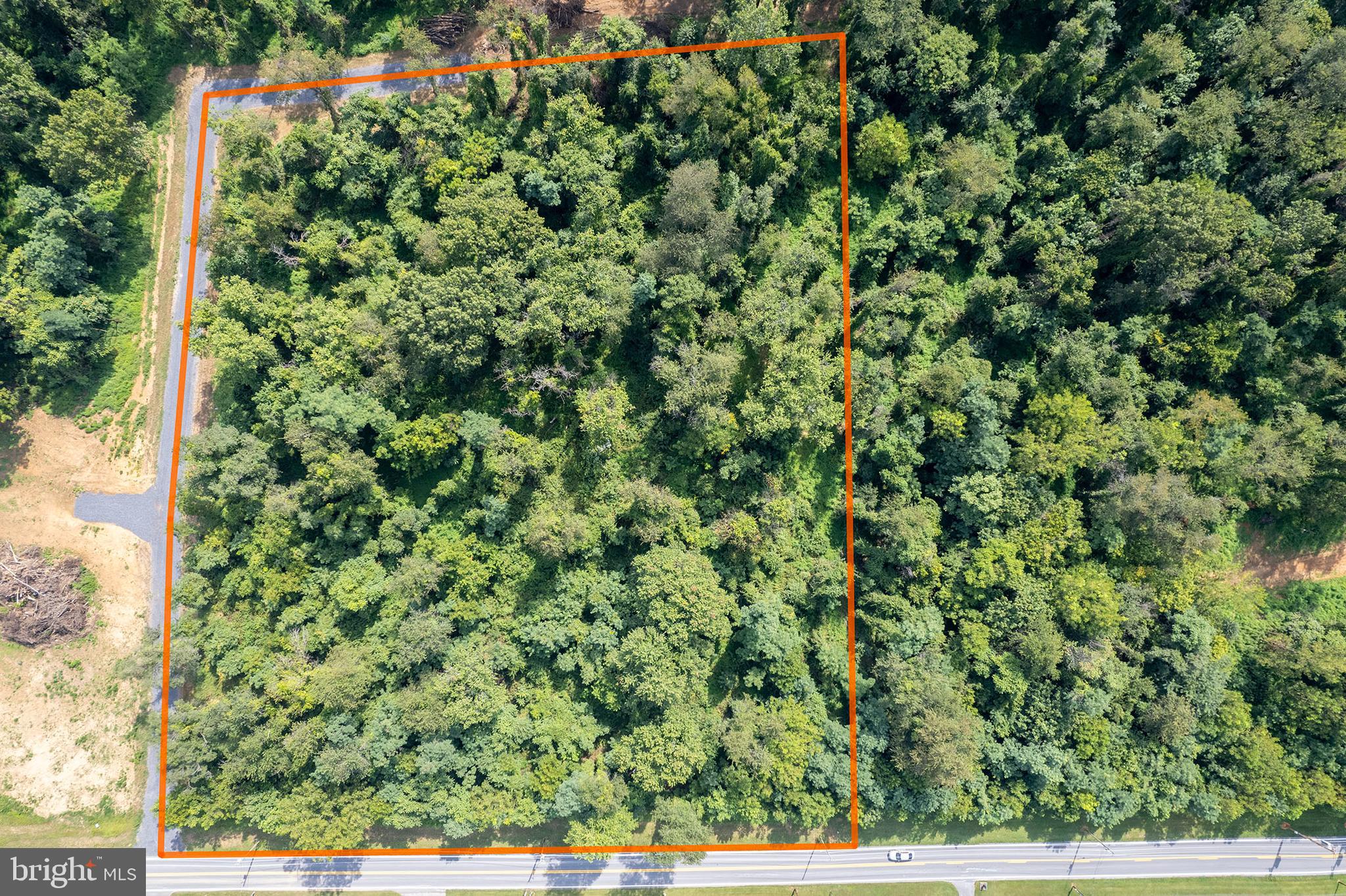 RARE OPPORTUNITY with Accessory Dwelling Unit Approval!!! Let your imagination run wild in wild & wonderful West Virginia! This gorgeous, wooded five-acre lot features a very gentle slope and minimal restrictions. It sits just 10 miles from Berryville and four miles from downtown Charles Town, making it perfect for NOVA commuters. The lot has already been approved for an Accessory Dwelling Unit (ADU) – so your dream of having a family compound or guest house can become a reality! And, there’s plenty of room for a large attached or detached garage, too. The property has been perc'd for a Class I system (see documents) – just BRING YOUR BUILDER!! There is no HOA; both chickens and bees are welcome. Please note: The lot was subdivided from a larger parcel on Huyett Road, but it is accessible from a private road off of Summit Point Road. Please refer to the plat and directions for a better idea of the location! The private road has not been named yet. Due to site work on an adjacent lot, please do not drive past the right-hand turn on the access road. If you would like to consult with a local builder, Hepler Homes is familiar with the property. Thank you!