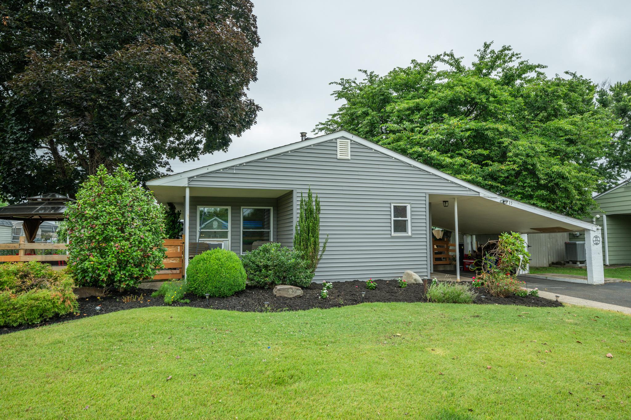 Welcome to 15 Elm, a charming 3-bedroom, 1-bath Levittowner-style home offering the ease of one-floor living in desirable Falls Township and the award-winning Pennsbury School District.

Situated on a spacious lot, this well-maintained home welcomes you with beautiful landscaping and a covered front porch—perfect for enjoying your morning coffee or unwinding at the end of the day—as well as a covered carport for added convenience and protection from the elements.

Step inside to a bright, spacious kitchen featuring abundant cabinet storage and generous counter space, making meal preparation and entertaining a breeze. Just beyond the kitchen is the inviting family room with recessed lighting and a cozy wood-burning fireplace creating the perfect space to gather with family and friends or relax on cooler evenings.

Down the hallway, you'll find three comfortable bedrooms, a full bathroom, and a conveniently located laundry area, all thoughtfully arranged for easy everyday living.

Outside, the fully fenced backyard provides a private retreat with plenty of space for entertaining, gardening, play, or summer barbecues.

Recent updates add even more value, including new siding and replacement windows (2023), a 200-amp electrical service with additional panel capacity, an electric vehicle charging outlet, and newer appliances.

Conveniently located just minutes from shopping, dining, parks, and major roadways, this home offers easy access to Philadelphia, New Jersey, New York, airports, train stations, and the Jersey Shore—making commuting and weekend getaways equally convenient.

Don't miss the opportunity to make this move-in-ready home your own!

**Home is eligible for the COMMUNITY LENDING PROGRAM through Peoples Security - up to 1% lower rates!**