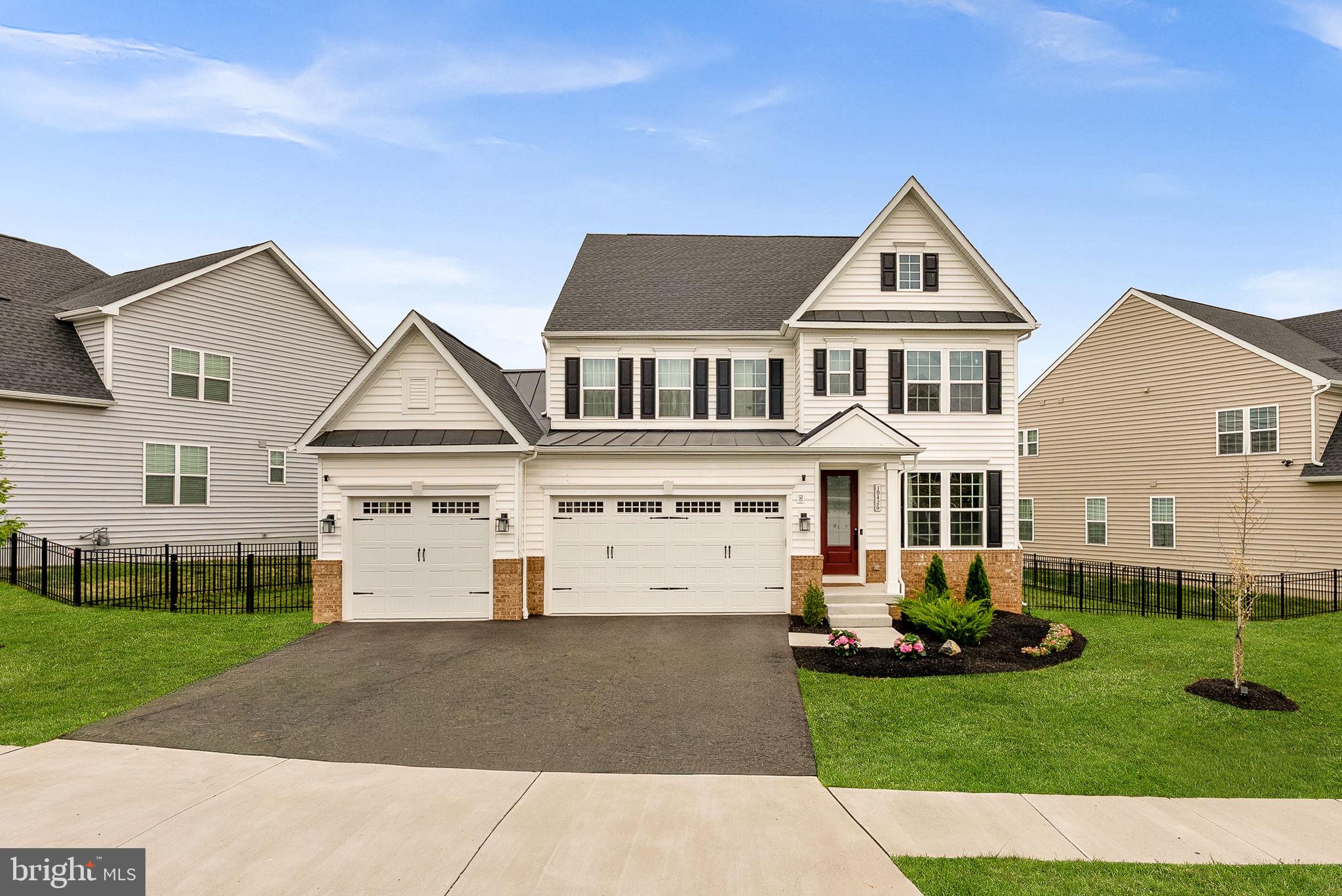 *JOIN US FOR A FOOD/DESSERT TRUCK AT THE SATURDAY OPEN HOUSE* Like-new single-family home in the sought-after community of Tuscarora Crossing featuring five bedrooms, five bathrooms, and three finished levels loaded with upgrades throughout. The main level showcases upgraded luxury vinyl plank flooring, a convenient main-level bedroom, and a full bath featuring upgraded hexagon tile flooring, floor-to-ceiling marble tile in the shower, and a black-framed glass shower door. A coat closet is conveniently located nearby. The open-concept floor plan includes a formal dining room, spacious family room with custom floor-to-ceiling El Dorado Casa Blanca stone surrounding the electric fireplace, and a bright breakfast area. The gourmet kitchen is beautifully appointed with quartz countertops, a waterfall island, upgraded backsplash, pendant lighting, range hood, and pot filler for added convenience. Custom built-ins provide pantry organization, while the mudroom features custom shelving and storage solutions. An additional coat closet also includes custom built-ins for even more organization. Oak stairs with black wrought-iron balusters lead to the upper level, where luxury vinyl plank flooring continues throughout the hallway. The spacious primary suite features a tray ceiling, two walk-in closets with custom built-ins, and a stunning spa-inspired bath complete with tile flooring, dramatic black-and-gold marble extending floor-to-ceiling in the shower and surrounding the soaking tub, quartz-topped dual vanities, and a frameless glass shower door. The second bedroom is generously sized and offers a walk-in closet and private ensuite bath. Two additional bedrooms share a Jack-and-Jill bathroom and each feature custom walk-in closets. The upper-level laundry room adds convenience with custom cabinetry and a hanging bar for clothes. The finished basement features plush carpeting, a large recreation area, and a custom wet bar with quartz countertops, tile backsplash, wood shelving, and sconce lighting - perfect for entertaining. A full bath and den, currently used as an office, provide additional flexibility for guests or working from home. The entertainment doesn't stop there - enjoy a newly-built, full Trex screened-in deck with vaulted ceilings, complimented by an electric fireplace AND heater - great for enjoying this space year-round. An uncovered portion of the deck serves a great space for grilling, too. The three-car garage is equally impressive, featuring epoxy flooring, LED lighting, custom NewAge built-in cabinetry, a mini-split system providing both heating and air conditioning, EV vehicle charger, upgraded insulated garage doors, upgraded Lift Master garage opener, insulated walls, and five dedicated outlets. Conveniently located less than one mile from The Village of Leesburg and Route 7, and just minutes from Inova Loudoun Hospital, Leesburg Premium Outlets, One Loudoun, and Route 28, this home offers an unbeatable location for commuters and those working remotely alike.

*Tax record doesn't take into account an additional 300 square feet of finished space in the mechanical room, which is now the den/office in basement*