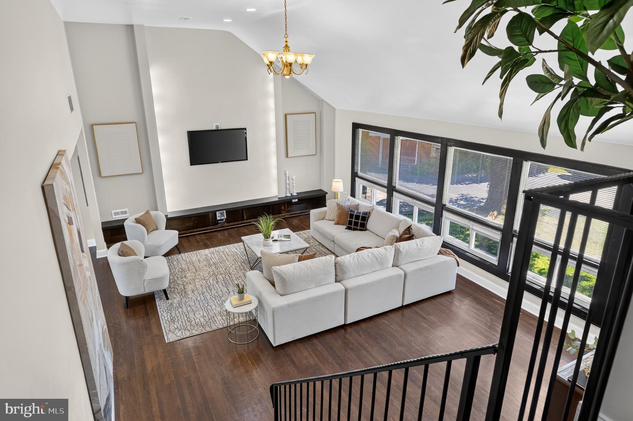 Welcome to 1011 Stanford Drive. This home has been completely revived and transformed into a luxurious private retreat. Step inside to a grand living room featuring soaring 20-foot ceilings, oversized windows filled with natural light, rich dark flooring, and custom tilework throughout the foyer. The brand-new kitchen is a chef’s dream, featuring top-of-the-line stainless steel appliances, sleek quartz countertops, and custom cabinetry—perfect for both everyday living and entertaining. The stunning multi-level primary suite also offers soaring ceilings, a private balcony overlook, and flexible bonus space ideal for a sitting room, office, or oversized closet. Every bedroom comfortably fits king-sized furniture.

The home also features a flexible en-suite perfect for an in-law suite or office, a fully finished basement, fresh paint throughout, updated plumbing and electric, and a multi-zone HVAC system with separate climate controls for each level. Situated at the end of a quiet cul-de-sac on one of the largest lots in the neighborhood, this rare half-acre property offers exceptional privacy, expansive outdoor space, and parking for up to six vehicles. While the driveway is shared, the home’s cul-de-sac location ensures plenty of additional parking. Conveniently located just minutes from Suburban Square, downtown Ardmore, top-rated schools, shopping, dining, and major commuter routes, 1011 Stanford Drive is a rare gem waiting for you. Schedule your private tour today.