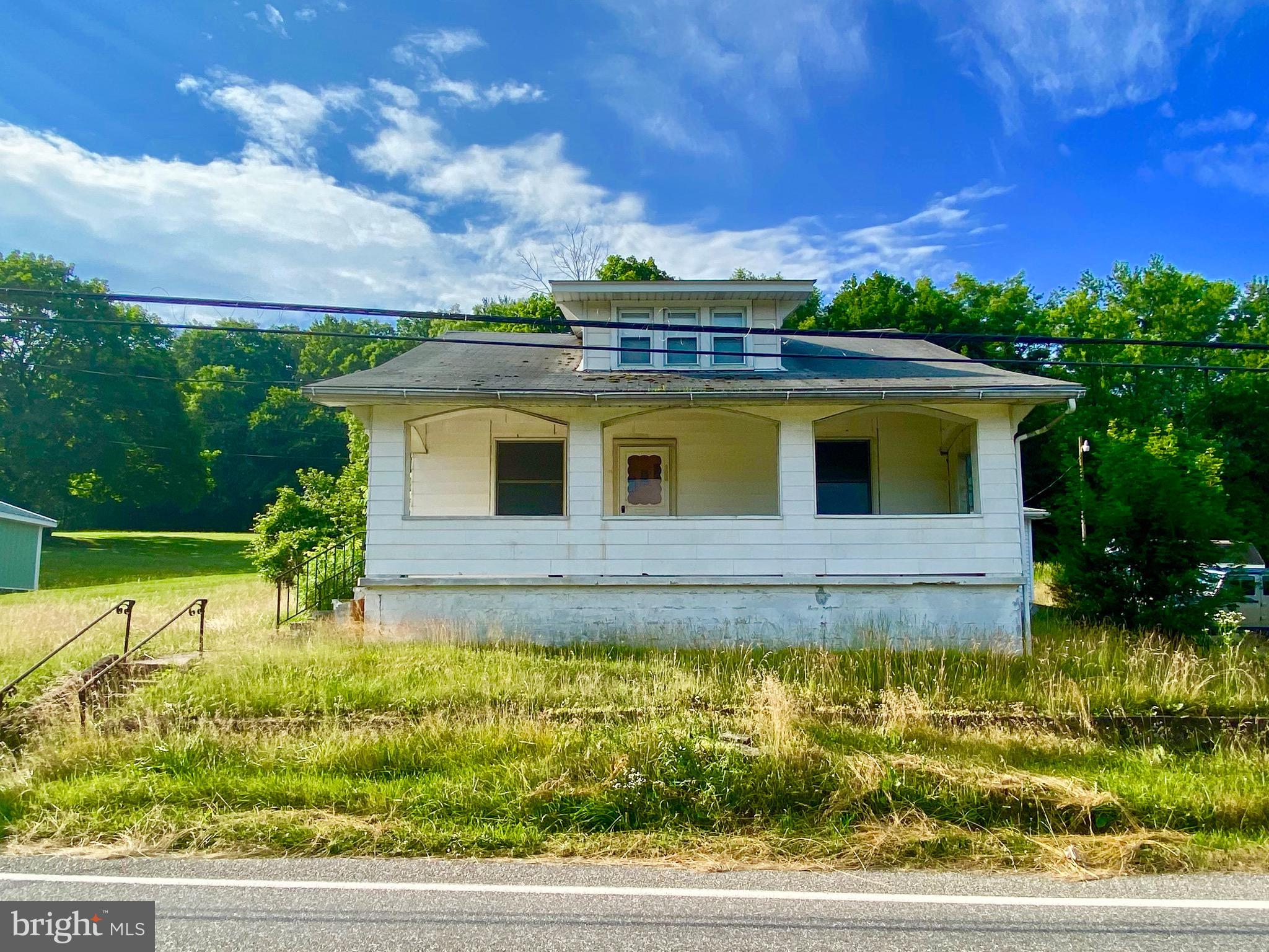 Single family 2BR/1BA home on a total of 2.64 country acres in Pine Grove. First floor has two bedrooms, living room, kitchen,  full bath, and laundry room. Large walk-up attic has the potential for additional bedrooms/living space. One car oversized garage offers additional storage; basement is unfinished. Lot is primarily wooded and includes a large shed. Property needs work but has potential.