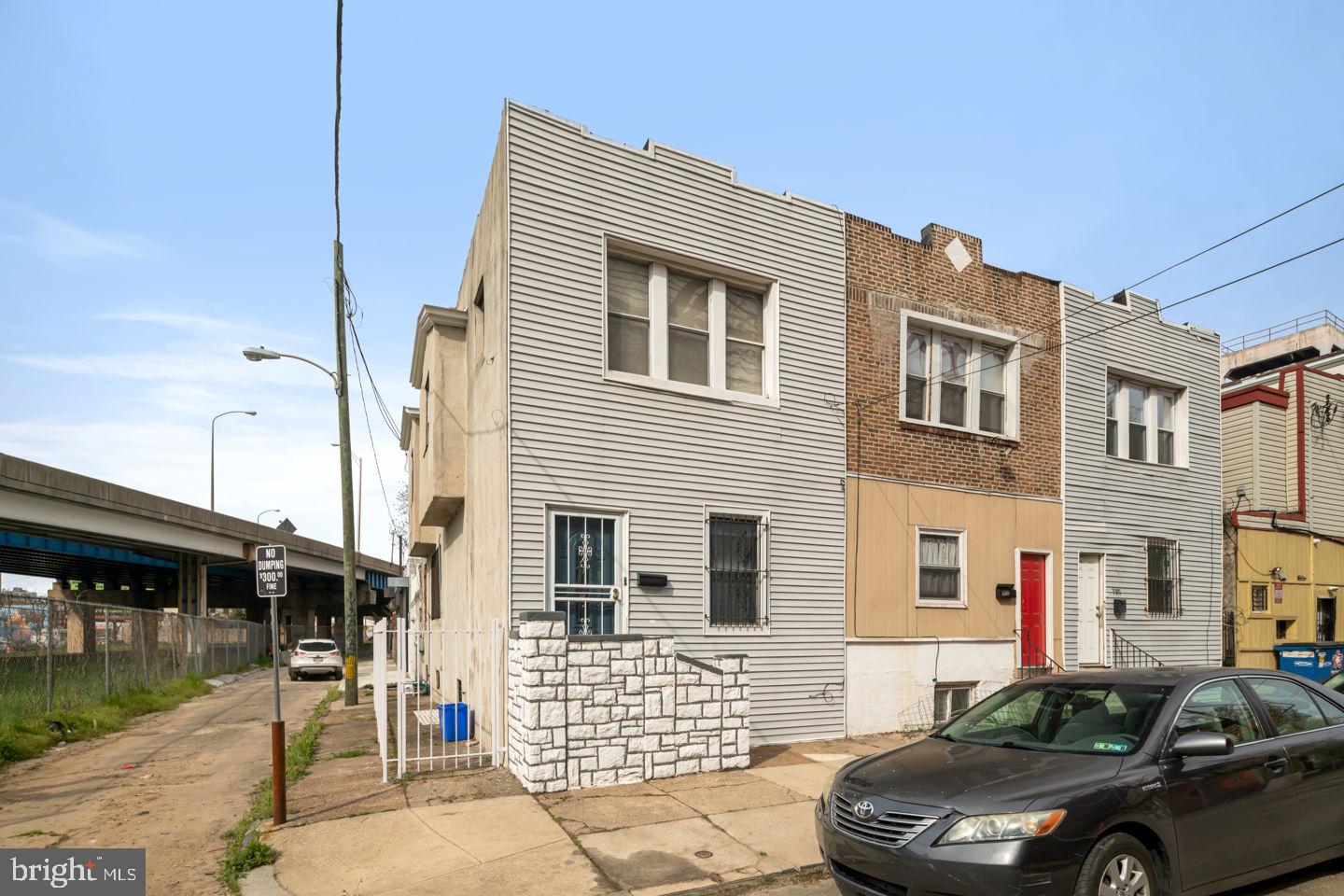 Incredible opportunity in the heart of Grays Ferry! Well maintained and family-occupied by the same owner for years, this unique corner property at 3311 Reed Street features a large, incredibly versatile footprint at almost 1,800 sq ft. Physically arranged with two separate units, a detached 1-car garage, and a spacious rooftop deck, this property is the ultimate blank canvas.  As it sits, the property represents the ideal opportunity for an expansive multi-generational family residence, an in-law suite layout, or a house-hacking owner-occupant looking for dedicated guest spaces.  Buyer's responsibility to verify zoning and use permit requirements.

The 1st floor unit features a bright, bi-level layout. The main floor offers an open-concept living and dining area flowing into an updated kitchen with stainless steel appliances, solid wood cabinetry, a breakfast bar, and a full bathroom. The lower level houses a private bedroom retreat, a side-by-side laundry area, a second full bathroom with a stall shower, and legal egress to the garage area.

The 2nd floor unit offers a bright two-bedroom, one-bathroom layout. It features a combined living and dining area boasting hardwood floors, a fully equipped kitchen, two generously sized bedrooms with great natural light, and a modern hall bathroom.

The outdoor and parking setup is a rare South Philly bonus. This corner lot includes a highly coveted detached 1-car garage, plus a fantastic rooftop deck area that is perfect for taking in city views or urban gardening.

Enjoy effortless accessibility to both Center City and University City thanks to multiple nearby public transit lines and quick highway access. You are steps away from local shopping, CHOP, HUP, and wonderful green spaces like Stinger Square and Lanier Playground. Schedule your tour today to see the incredible layout and potential of this South Philly corner gem!