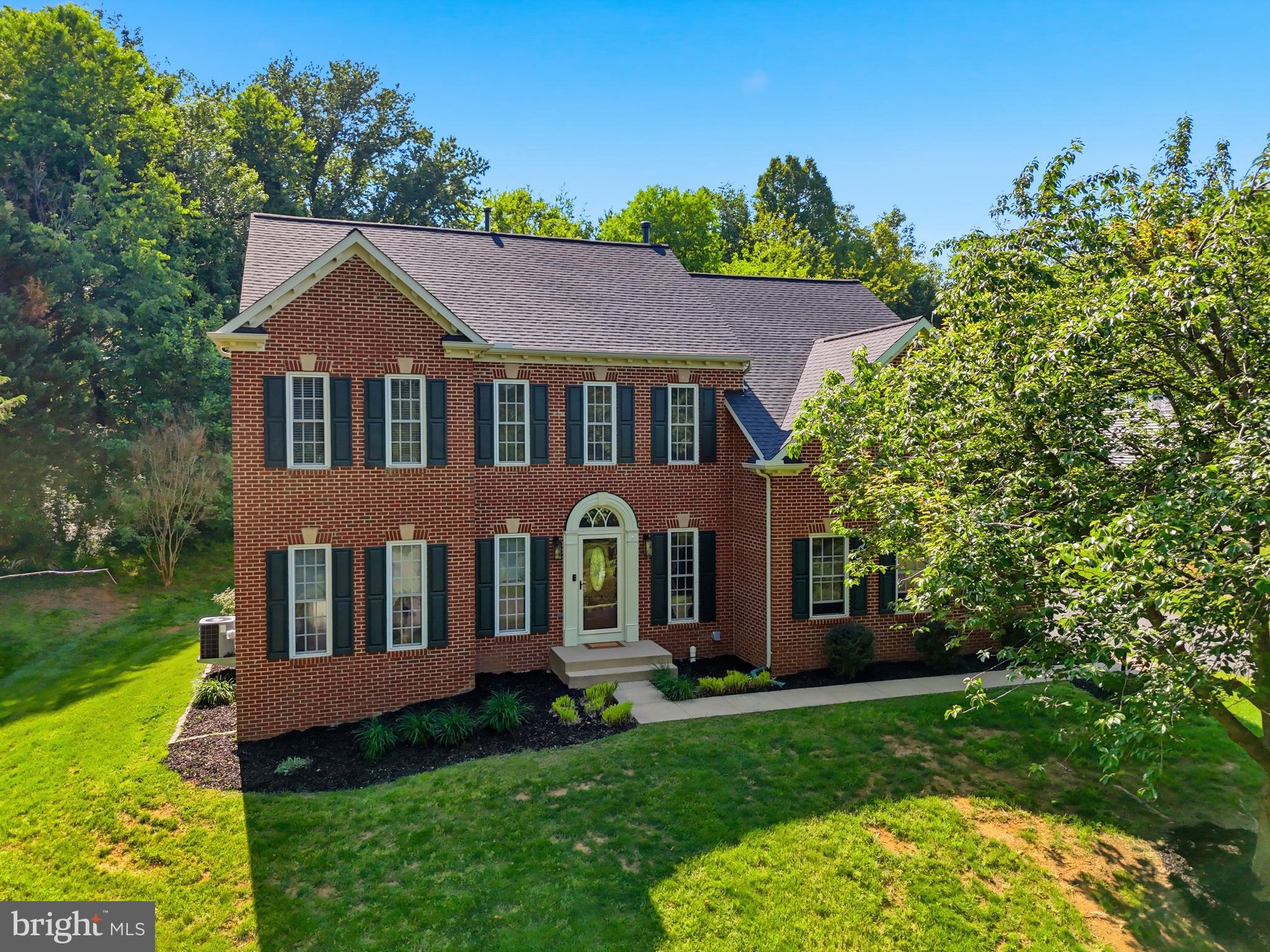 Nestled in the sought-after South Wales community, this elegant 5-bedroom, 3.5-bath home offers the perfect blend of timeless sophistication and modern comfort. From the moment you step inside, you are welcomed by a dramatic two-story foyer featuring a stunning double-landing staircase and hardwood floors throughout the main level.

Designed for both everyday living and entertaining, the open floor plan seamlessly connects the spacious kitchen to the cozy family room with a fireplace and the bright, sun-filled morning room. The chef’s kitchen is beautifully appointed with a large center island, bar seating, a propane cooktop, double ovens, stainless steel appliances, and abundant cabinetry. Formal living and dining rooms provide elegant spaces for hosting gatherings and special occasions.

Retreat upstairs to the expansive primary suite featuring a luxurious spa-inspired bath complete with a deep freestanding soaking tub, separate shower, and double bowl vanity. Three additional generously sized bedrooms and another full bath on the upper level provide ample room for family and overnight guests.

The fully finished lower level is an entertainer’s dream with spacious open recreation areas ideal for movie nights and gatherings. The theater system and pool table both convey with the home, creating the ultimate entertainment space. An additional bedroom with a Jack-and-Jill bath offers excellent flexibility for an au pair, in-law suite, or private guest accommodations. This level also includes unfinished storage space and a convenient walk-up staircase leading to the rear yard.

Step outside to enjoy the beautifully landscaped patio, complete with a fire pit, creating the perfect setting for outdoor entertaining or relaxing evenings under the stars in the private rear yard.

Combining elegant design, functional living spaces, and exceptional amenities, this remarkable home offers everything today’s buyers are looking for in a picturesque community setting.