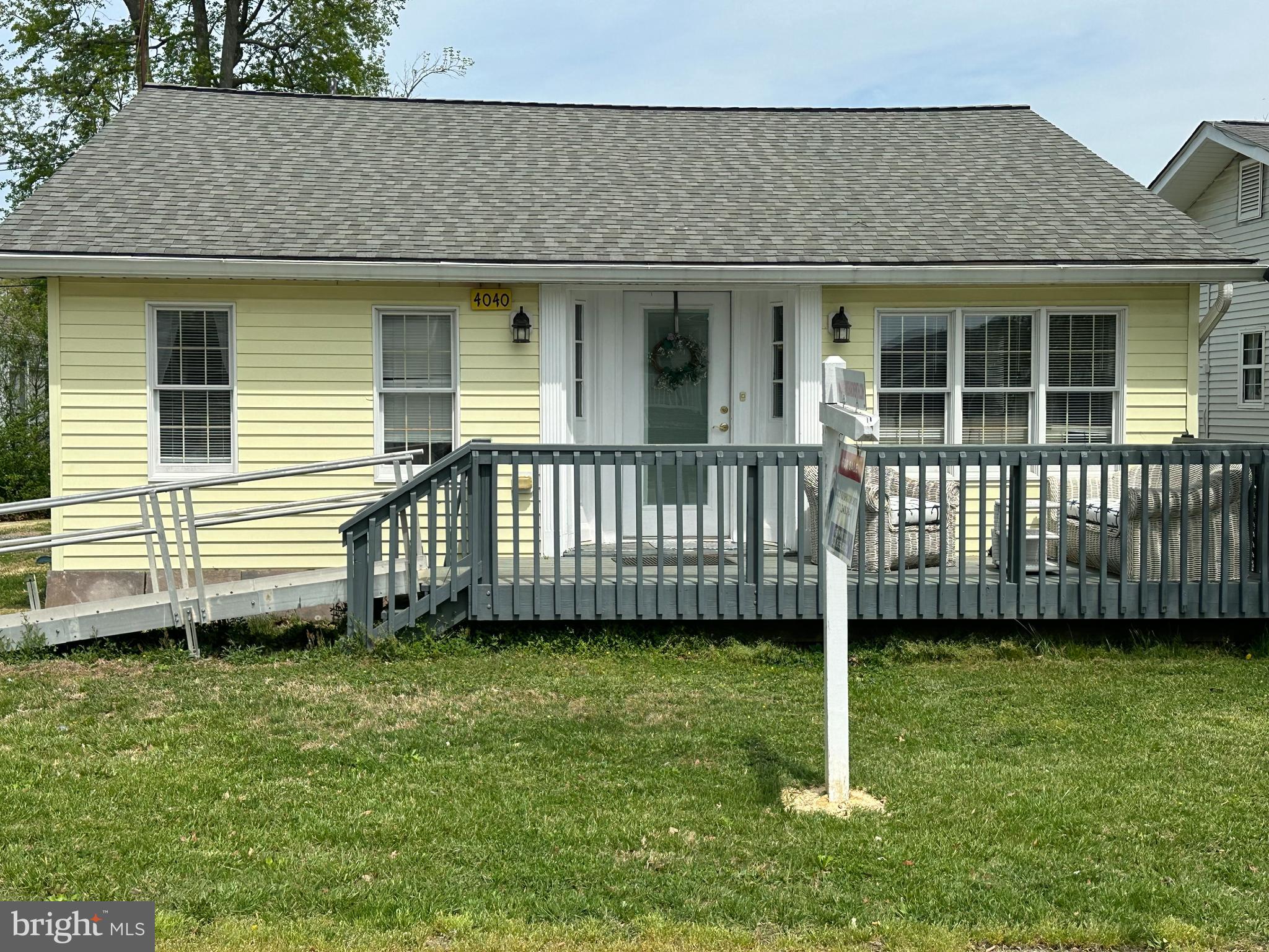 Charming North Beach rambler ideally situated just blocks from the Chesapeake Bay and within walking distance to local shops, restaurants, bars, art galleries, the new library, fishing pier, boardwalk, and beach. Enjoy coastal living with small-town charm and everyday convenience right outside your door. This two-bedroom, two full bath home features an open floor plan highlighted by a cathedral ceiling spanning the great room and kitchen, creating a bright and spacious living environment perfect for relaxing or entertaining. The main level includes a dedicated laundry area with full-size washer and dryer for added convenience. Outdoor living is equally inviting with a front deck overlooking the yard and a rear deck that opens to a large backyard — ideal for gatherings, gardening, or simply enjoying the outdoors. The extended driveway provides ample off-street parking and runs from the front of the home to the rear alley for easy access. Conveniently located for commuters with easy access to Washington DC, Annapolis, Joint Base Andrews and Baltimore, this property is perfect as a primary residence, weekend retreat, or investment opportunity. Experience the best of beach-town living in the heart of North Beach.