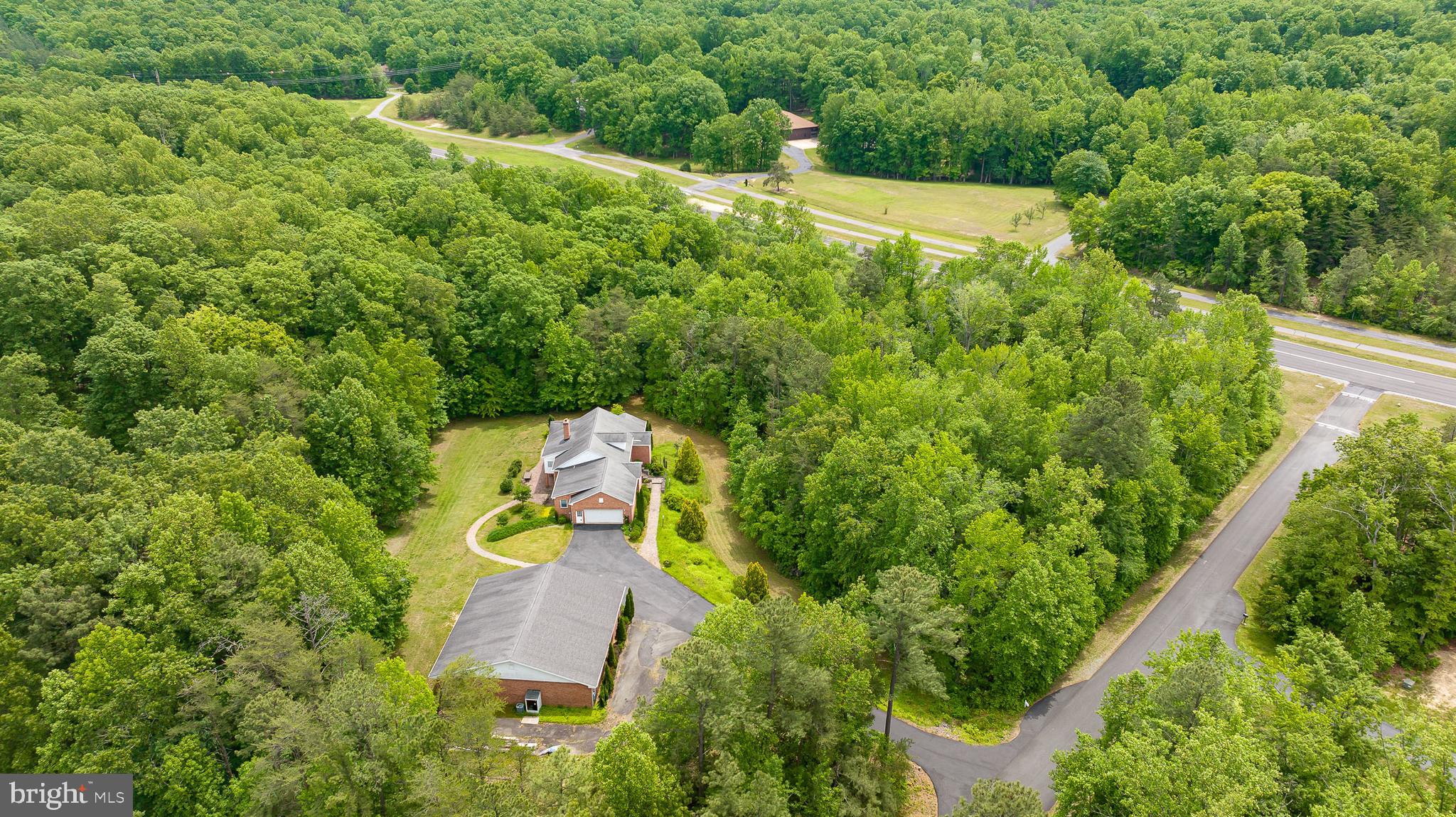 Discover an extraordinary aviation enthusiast’s paradise at 10 Piper Place, nestled within the exclusive Dogwood Airpark - VA42, the only private airpark in the DC/MD/VA metro area. This stunning 5.59± acre estate, surrounded by mature trees and a serene stream, offers a rare blend of luxurious living, modern amenities, and unparalleled aviation access, just 5.9 nautical miles outside the Washington SFRA.

This property is also available for rent.  Call owner or lister for details

Residence Overview:
Built in 2001, this 5,650± sq ft brick veneer home, designed for one-level living, exudes elegance and functionality. The main floor, spanning 2,900± sq ft, features oak hardwood floors in the great room, dining room, and hallway, complemented by abundant natural light and ample storage. The great room boasts a natural stone masonry fireplace with a gas log insert, perfect for cozy evenings. The enclosed porch, with mahogany hardwood floors, exposed brick walls, and a dedicated HVAC unit, offers a tranquil retreat. The master suite is a haven of luxury, featuring a large walk-in closet, whirlpool tub, separate shower, bathroom fan/heater, and a private toilet/bidet compartment with tiled finishes. With 3 bedrooms, 3.5 bathrooms, and multiple office spaces, this home is ideal for both relaxation and productivity. A 2-zone HVAC system, ceiling fans throughout, and two hot water heaters ensure year-round comfort.

Lower Level & Additional Living Space:
The finished lower level adds 2,600± sq ft of versatile living area, complete with a pellet stove and a full bathroom featuring an extra-large tiled shower—perfect for an in-law suite or guest apartment. An unfinished 150± sq ft storage/mechanical room provides added utility.

Garages & Aviation Amenities:
The attached oversized garage (25’ x 25’) features an extra-wide 8’ high doorway, separate entrance, and access to the laundry room with front-load washer/dryer, utility sink, and shelving. A ventilated shed offers convenient storage for lawn equipment. The crown jewel of this property is the 3,480± sq ft detached garage/hangar (58’ x 60’), constructed with brick and reinforced block, featuring a large hydraulic door, separate entrance, 15’ high ceilings, multiple ceiling fans, and lights. Equipped with a central HVAC system, a discrete office space with a separate HVAC unit, and an air compressor with multiple connections and a noiseless exterior power unit, this hangar is a pilot’s dream.

Outdoor Features:
Interlocking paver-covered porches, sidewalks, and a patio enhance the outdoor experience, offering inviting spaces to enjoy the peaceful surroundings. The expansive lot provides privacy and room for outdoor activities, all within a quiet community with private roads ideal for walking or jogging.

Airpark & Location Highlights:
Dogwood Airpark features a newly rebuilt and paved 4,100’ runway (May 2022) and is just 2 nautical miles from a county airport with fuel (KRMN). With reasonable HOA restrictions and annual dues of $2,900, residents enjoy a close-knit, aviation-centric community. Conveniently located minutes from historic Old Town Fredericksburg, the University of Mary Washington, shopping, hospitals, and the VRE, the property is also a 55-minute drive to Dulles, Reagan-National, and Richmond airports, with easy access to I-95.

Why 10 Piper Place?
This property is a rare gem, combining a spacious, well-appointed home with state-of-the-art aviation facilities in a prime location. Whether you’re a pilot seeking direct runway access or a homeowner desiring a luxurious, private retreat, 10 Piper Place offers an unmatched lifestyle. Don’t miss the chance to own a piece of Fredericksburg’s premier airpark community.