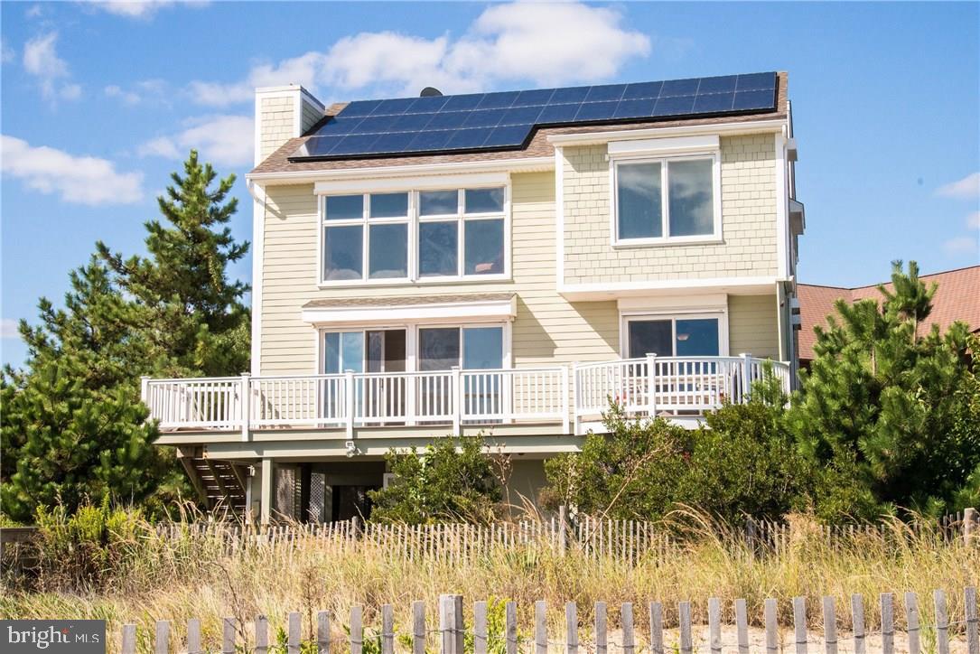 Oceanfront living at its finest!  This gorgeous home offers direct beach access complete with a private walkway.  This exquisite home has never been rented and it shows.  Property features 5 spacious bedrooms (4 w/ en-suite baths), 2 living areas with panoramic ocean & beach views, gourmet kitchen, elevator, solar panels, hot tub, great storage & more!  Superb views from the many sun decks & roof top deck!  This home is a must see!  Potential rental income of $85,000!