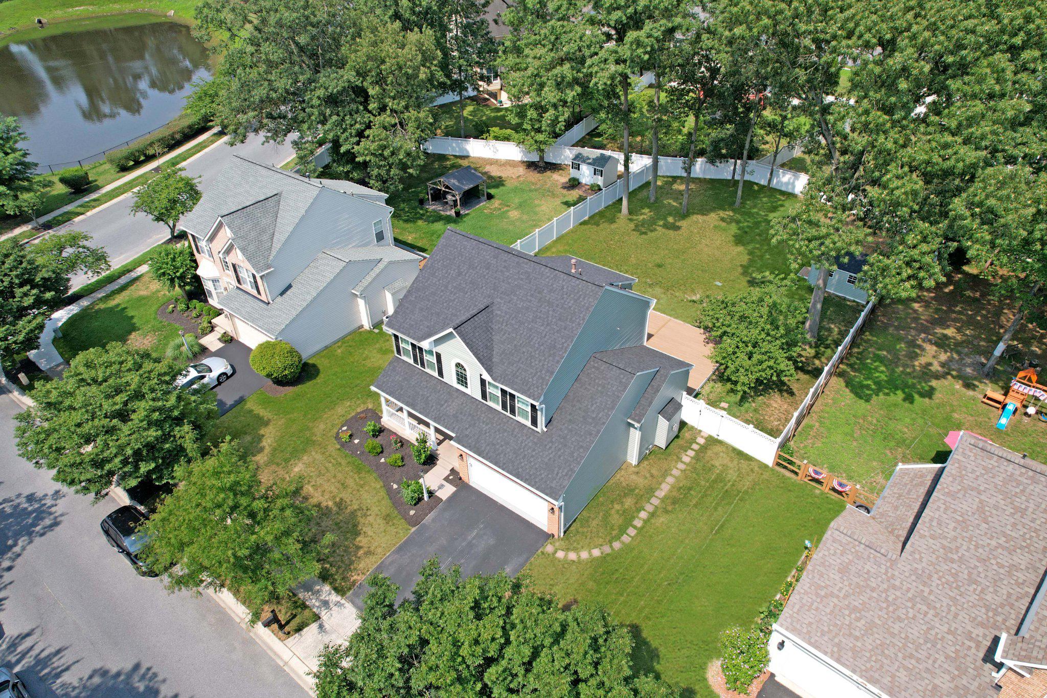 Nestled in the prestigious, sought-after community of Farmington Village, this exquisite "like new" Colonial residence embodies luxury and sophistication. Spanning over 3,400 sqft, this meticulously maintained home features five spacious bedrooms and three & a half elegantly appointed bathrooms, including a primary suite with a jetted tub, walk-in shower & walk-in closet w/ built-ins, perfect for unwinding after a long day. Step inside to discover a harmonious blend of modern design and classic charm. The interior boasts rich hardwood floors, 9' ceilings, plush carpeting, and custom ceramic tile, complemented by recessed lighting and built-ins that enhance the home's functionality. The incredible gourmet kitchen is a chef's dream, featuring premium countertops, 42" soft-close cabinets, gas cooking, stainless steel appliances, and a large spacious island w/ ample seating, ideal for entertaining. The adjoining family room flows seamlessly from the kitchen area, highlighted by a cozy gas fireplace with glass doors and transom windows bringing in an abundance of natural light throughout, creating an inviting atmosphere. Also on the main level, you will find French doors to a private office/den off of the 2-story foyer as well as a formal dining area and a conveniently located laundry room adjacent to the kitchen. The lower level boasts an additional expansive family room, 5th bedroom, full bath & fitness/studio. The outdoor space is equally impressive, with a nice-sized maintenance-free deck overlooking a huge level 0.3-acre fenced lot, perfect for gatherings or quiet retreats. Also, there is an attached front-loading 2-car garage w/ 2-car paved driveway & street parking, convenient for numerous vehicles. Enjoy the community's luxurious amenities, including a sparkling in-ground pool w/ kiddie pool, tennis courts, and scenic jog/walk paths. This impressive home is truly "like new". Featuring many recent updates in the past few years. Including: architectural shingled roof, siding, energy-efficient windows & doors, gutters, composite deck, and vinyl fencing. Interior updates include: luxury kitchen, refinished hardwood flooring, lighting, and a fully renovated tiled hall bathroom with high-end finishes. Experience the exclusive lifestyle that this remarkable property offers, where every detail has been thoughtfully curated for your comfort and enjoyment. Great Price - Won't Last!!

*The sellers recently purchased and love this home, but are being corporately relocated.