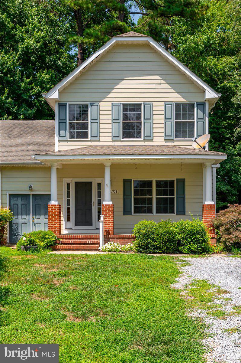 Welcome to 21128 Striper Run, a charming 3-bedroom, 2.5-bath home nestled in the heart of Rock Hall. Offering an exceptional opportunity to own in one of Maryland's most sought-after waterfront communities, this home combines classic charm, quality features, and outstanding value.

Step inside to find beautiful real hardwood flooring throughout the main level, creating warmth and character from the moment you enter. The inviting living room features a cozy gas fireplace, making it the perfect place to gather with family and friends during cooler evenings.

The spacious floor plan offers comfortable living with generously sized bedrooms, including a private primary suite with its own full bath. Just off the rear of the home, you'll discover a screened porch overlooking the backyard—a peaceful space to enjoy your morning coffee, entertain guests, or simply relax while taking in the tranquil surroundings.

Outside, mature landscaping and a welcoming covered front porch add to the home's curb appeal, while the quiet setting offers the small-town charm that makes Rock Hall such a desirable place to call home.

Conveniently located just minutes from marinas, restaurants, shops, parks, and the Chesapeake Bay, this home offers the perfect blend of comfort, character, and Eastern Shore living.

Don't miss your opportunity to make 21128 Striper Run your next home!