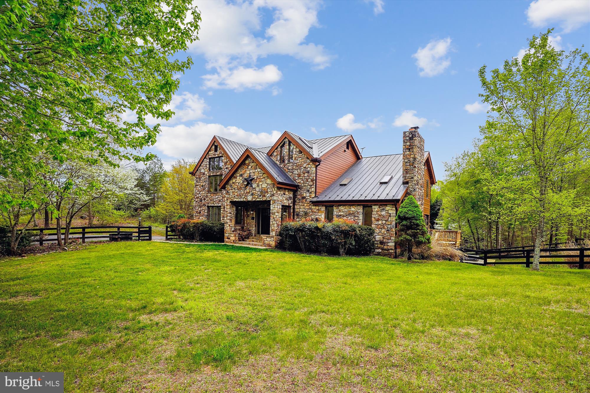 With fresh renovations, this 5,000+ square foot custom built home on 35 private acres includes 6 bedrooms, 4 baths, a salt water pool and hot tub, loads of natural light, metal roof, and high end finishes.  Recent updates include the primary and secondary bathrooms, kitchen updates, new appliances, long lasting engineered wood siding, and white oak hardwoods. This home has year-round appeal to all lifestyles; one can both entertain or enjoy quiet weekends by the pool and hot tub, working in the shop with radiant heat floor infrastructure, or simply relaxing by the firepit in this nature filled sanctuary.   The updated kitchen, expansive views and inviting wood burning fireplaces add welcoming warmth to the home, and a large basement complete with a guest suite provides easy access and privacy for guests.  Additional features of the finished basement include a wet bar, full pool table, fireplace, bathroom, bedroom, and walk-out access to the pool and hot tub.  Upstairs, enjoy your morning coffee or nighttime beverage of choice on the balcony directly off of the primary suite. With Starlink and a cell booster conveying, both the benefits and features of this property are too much to list.  Come see for yourself!  No HOA or other restrictions. Property qualifies for forestry land use tax deduction!
Other features and benefits include:
Kitchen: large walk-in pantry, wine fridge, separate coffee bar area, plenty of cabinet storage
Library/office with custom built-in shelving
Primary Suite: two spacious walk-in closets with custom shelving, soaking tub, sauna
Cathedral ceilings throughout: foyer, family room, primary bedroom, primary bath
Upper and lower decks, large patio
Beautiful stone exterior
Serene rolling fenced pasture
Energy efficient 2x6 framing with R19 wall insulation
LED lighting throughout
Mature hardwood trees with several natural springs and streams on property
1500 square foot (30x50x10h) detached garage/ workshop with radiant floor heating hookup and a seperate 200 amp electrical service.
One exterior house camera is on the premises.