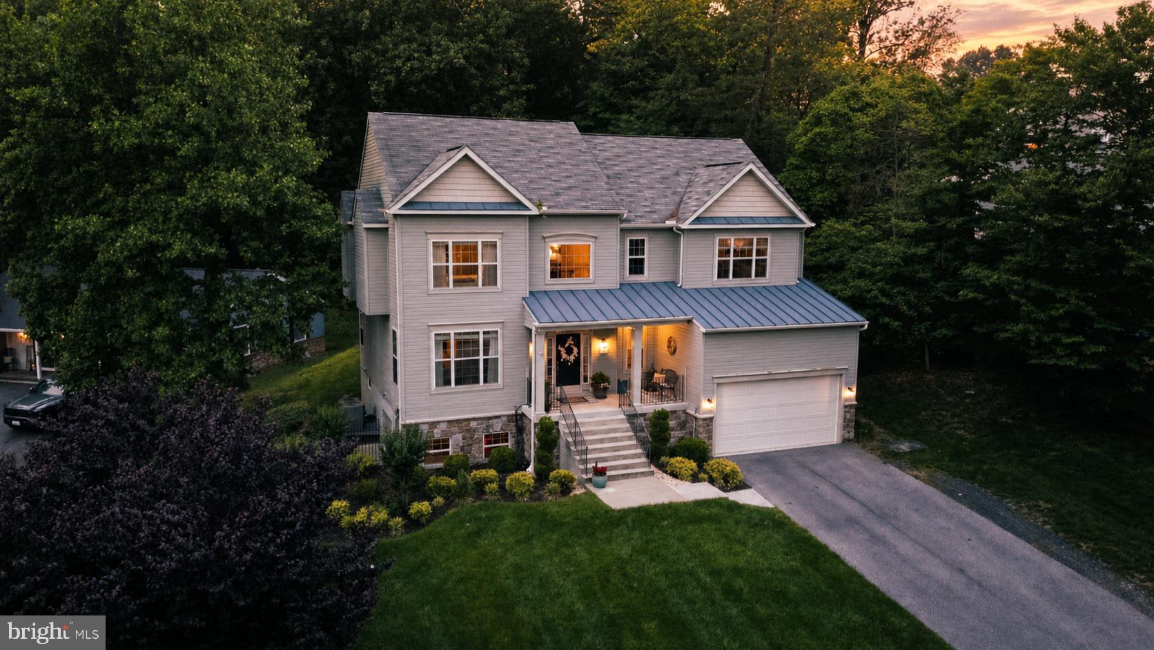 **Seller Help Available for Full Price Offer** The only home for sale in coveted Marshalee Estates — a custom-built 2016 colonial that presents as new, set privately above the street on roughly a half acre lot. This exquisite colonial home offers a harmonious blend of luxury and comfort. Spanning 2,912sqft., the open coastal-living floor plan invites you to experience a warm ambiance, enhanced by gleaming hardwood floors and elegant recessed lighting. The gourmet kitchen, featuring upgraded countertops and stainless steel appliances, is a culinary enthusiast's dream, complete with a spacious island and pantry for effortless entertaining. Retreat to the primary suite, where a lavish walk-in closet and a spa-like bathroom with an oversized walk-in shower await. Gather in the cozy family room, warmed by a gas fireplace, or enjoy serene evenings on the inviting porch or built in fire pit area in the rear yard. With four bedrooms and three and a half baths, and 9ft ceilings, this home is designed for both relaxation and gatherings. Experience the exclusive lifestyle this remarkable property provides, where every detail is crafted for your comfort and enjoyment. Walk to Watermont Swim Club (2 min), Rockburn Elementary (5 min), and 400-acre Rockburn Branch Park (5 min); minutes to I-95/MD-100 and BWI. No HOA.