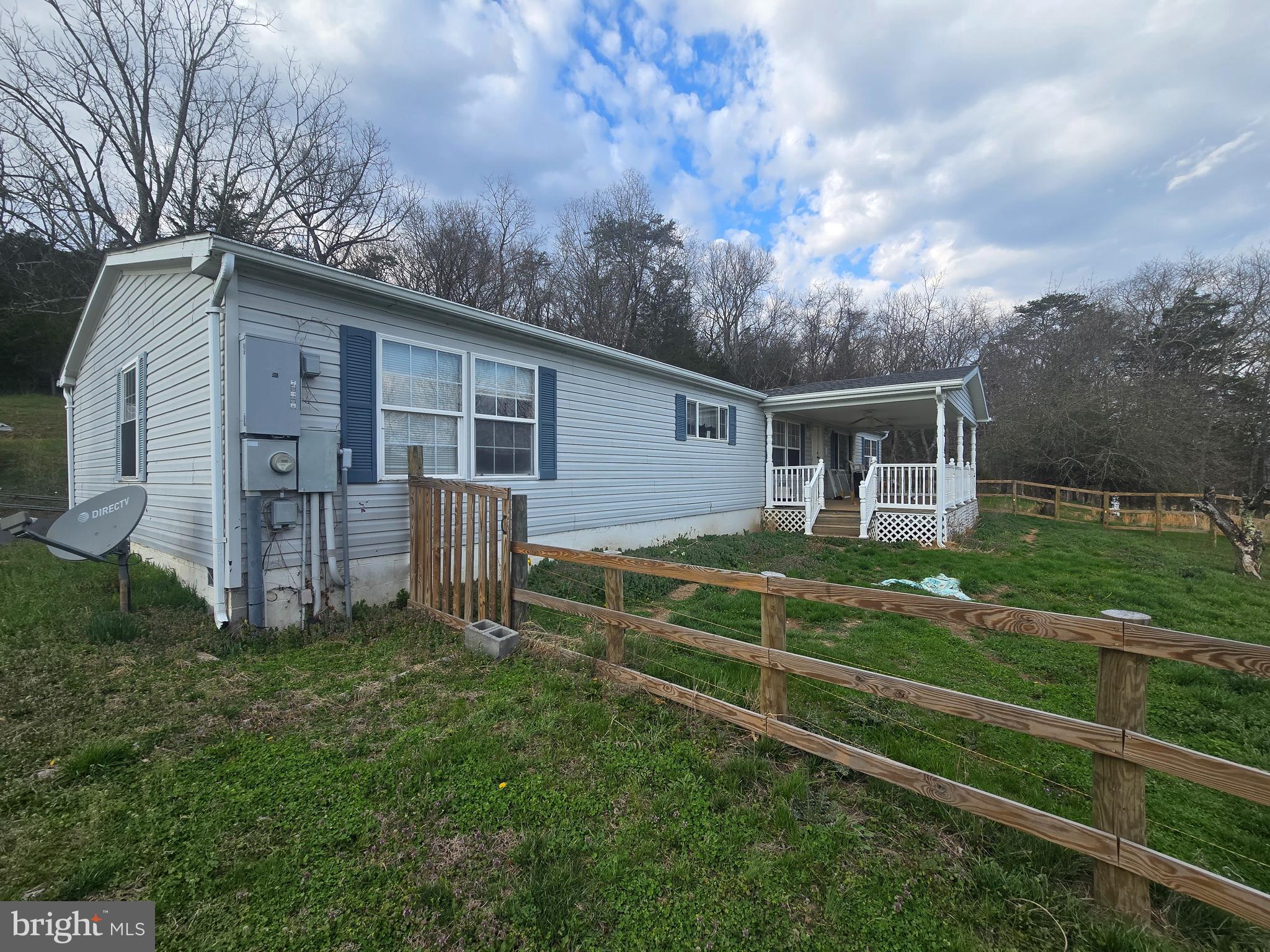 Bring your vision and toolbelt to 698 Webbs Farm Lane! Situated in a quiet Burlington setting, this 3-bedroom, 2-full-bath manufactured home is bursting with untapped potential. While the home needs some love and cosmetic updates, it offers a fantastic footprint and a highly desirable 2-car detached garage perfect for a workshop, vehicle storage, or hobby space. The true star of this property is the setting—step outside to take in the absolutely gorgeous, panoramic views that surround the lot. This property is an incredible opportunity for an investor looking for their next project, or a buyer looking to sweat-equity their way into a scenic rural retreat. Schedule your showing today and see the potential for yourself!