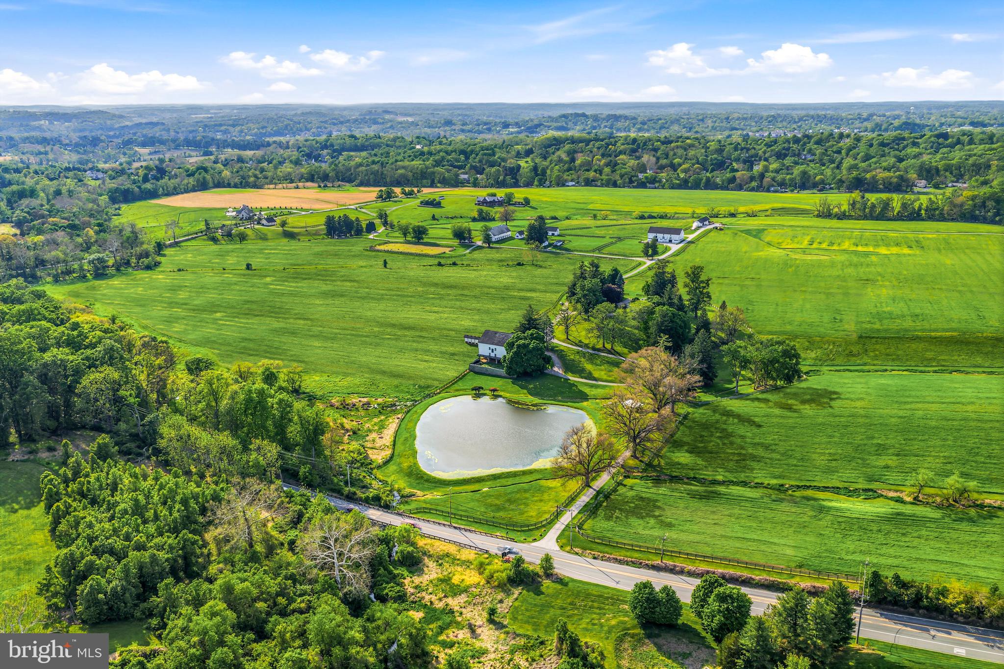 This spectacular 24.41 acre, subdivided and conserved parcel, once part of historic Crebilly Farm, features breathtaking views, surrounded by additional conserved parcels. It features a private gated entrance winding past a charming stone chapel, meticulously crafted by artisan John Milner, and a historic Serpentine Stone bank barn with scenic views of the serene pond. The new owner may build the home of their dreams where a current ranch home exists or renovate this 1950's residence as desired. Enjoy your own access to the adjacent 206 Natural Lands Trust acres owned by Westtown Township, providing for trails and passive recreation in the future. Seize this unique opportunity to live in a serene, pastoral oasis in a coveted and convenient location, just minutes from renowned schools, shopping, restaurants, transportation, Philadelphia International Airport and more.