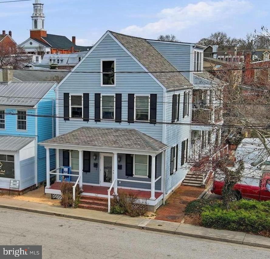 Mixed-use commercial property in charming historic Chestertown. 327 Cannon was newly constructed in 2006, yet is perfectly situated in bustling historic district. Offering historic charm without the extra maintenance. The building contains two large units with many possibilities.
The first level is outfitted with a commercial kitchen and large dining space overlooking Cannon St. Over 1300 sq ft of professional kitchen space, an office, and dining area. The space has many possibilities for a restaurant or other commercial business in the future. Currently, this unit is leased to Occasions Catering. 

The upstairs apartment is inviting and spacious, offering two bedrooms each with an ensuite full bathroom. The living space is open and airy, with ample natural light, vaulted ceilings, hardwood floors and a gas fireplace. The large loft could be an office, den, or creative studio space. The walk-in attic provides additional storage.  An ideal investment in historic Chestertown.