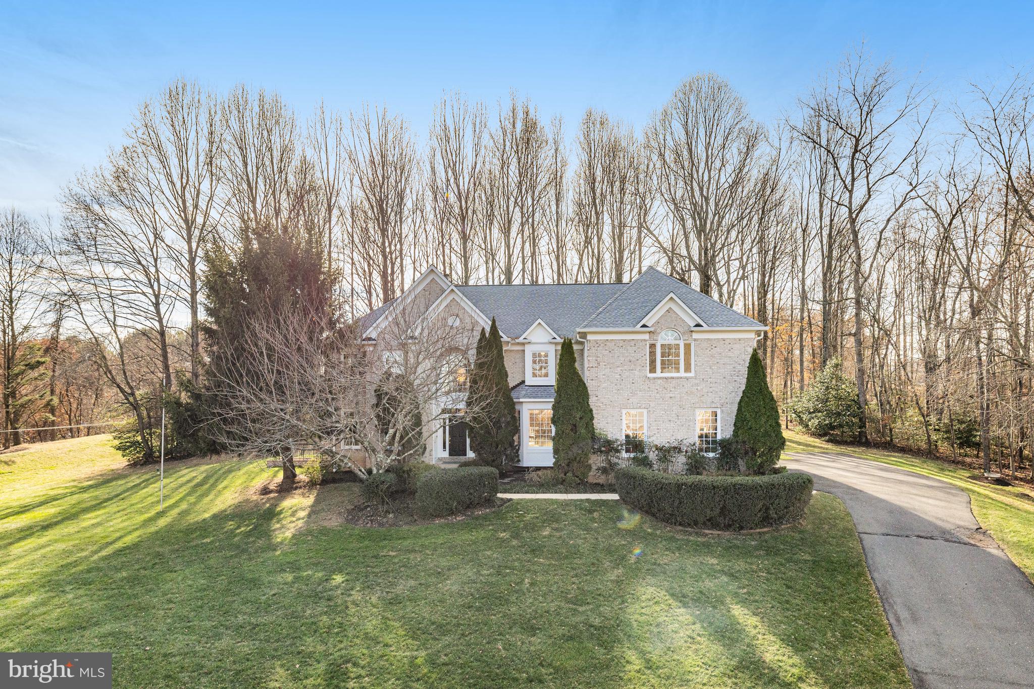 On a quiet no-through street don’t miss this brick colonial sited on a 1.75 -acre property.  The residence offers 4 bedrooms plus 3 ½ baths situated in a beautiful private yard with mature trees.  There is great flow and transitions between spaces on over 4106 sq ft of living space.  Notable highlights on the main level include the large family room with dramatic 2 story ceiling, wall of windows with views of the woodland scenery and 2nd staircase. Open eat-in kitchen with island and gas cooktop.  The upper level offers the perfect owner’s suite with tray ceiling, 2 walk-in closets and spacious bathroom.  The 2nd bedroom is ensuite, bedroom 3 provides private access to shared hallway bathroom, and all bedrooms include new plush carpet. The walk-up, lower level provides tall ceilings, full-sized windows and bathroom rough-in a great opportunity to create the guest suite and rec room of your dreams.
