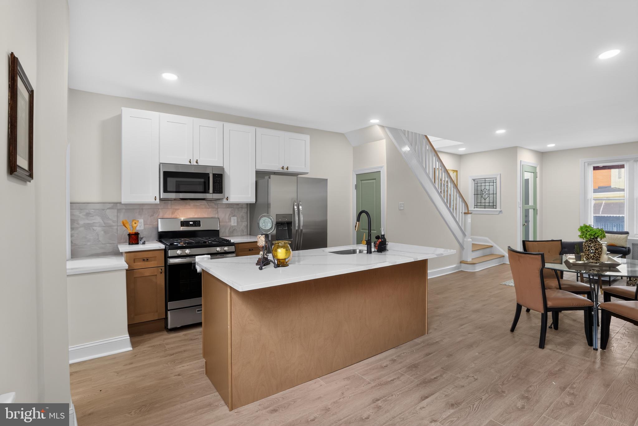 Welcome to 5741 Hunter Avenue, a beautifully renovated 3-bedroom home that's move-in ready! Step inside to discover brand-new laminate wood flooring flowing throughout the spacious living room, dining room, and newly renovated kitchen. The inviting living room is highlighted by a stylish accent wall that adds the perfect touch of modern character.
The stunning kitchen is designed to impress, featuring elegant two-tone shaker cabinetry with crisp white upper cabinets and warm wood-tone lower cabinets, complemented by beautiful white granite countertops, stainless steel appliances, and plenty of cabinet space. The oversized center island serves as the heart of the home, complete with a built-in sink, dishwasher, and an extended granite breakfast bar—perfect for casual dining, entertaining, or meal prep.
Upstairs, you'll find three spacious bedrooms, each finished with brand-new laminate wood flooring and offering comfortable living spaces filled with natural light. The updated full bathroom completes the second floor.
Whether you're a first-time homebuyer or looking to add to your investment portfolio, this tastefully renovated home offers modern finishes, thoughtful design, and exceptional value. Schedule your showing today!