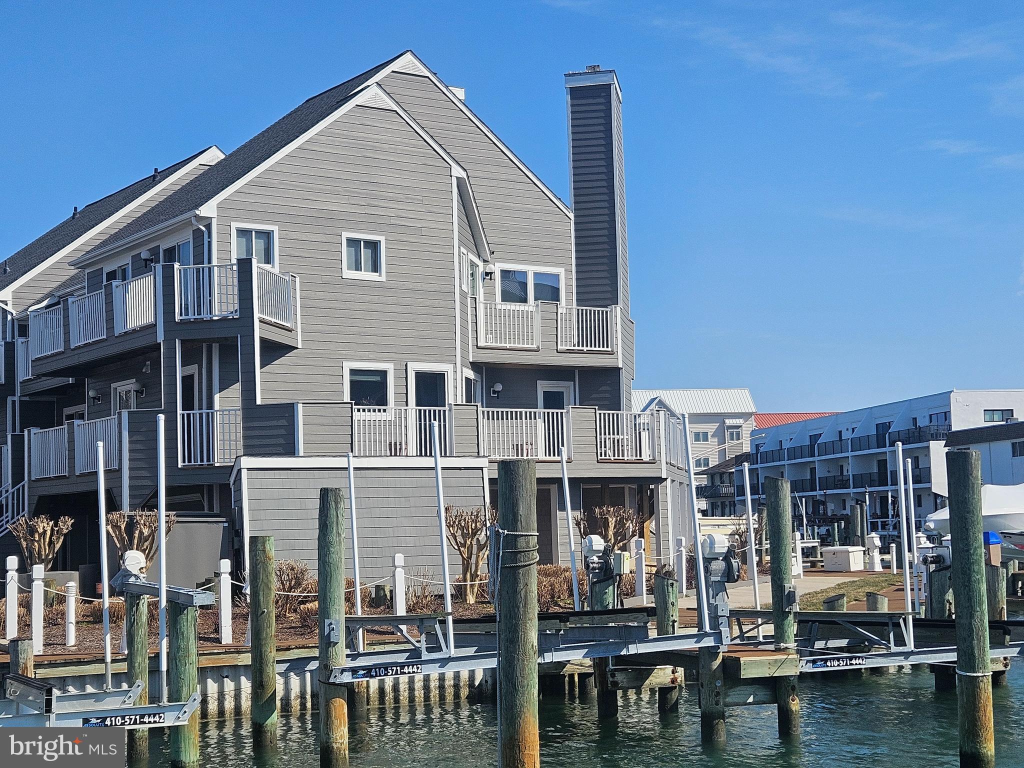 Discover the Ultimate in Coastal Living on Harbour Island!  Experience luxury, flexibility, and breathtaking water views in this extraordinary end-unit townhome located in the exclusive gated community of Harbour Island.  Spanning 4,354 sq ft, this versatile dual-unit townhome, offering direct bayfront living with coveted southern exposure, is currently configured as one expansive home with six bedrooms and four and a half bathrooms, but can easily be separated back into two independent townhomes.  

This home invites you to enjoy sunset reflections dancing across the water and spend your evenings enjoying coastal breezes from the comfort of your private wrap-around patio.  Boating enthusiasts will appreciate the deeded boat slip, offering seamless access to the open bay for spontaneous sunset cruises or weekend adventures.  

Inside, you'll find six spacious bedrooms and four full bathrooms, plus a powder room, offering ample space for family, guests, or a multi-generational lifestyle.  This is more than just a home - it's a lifestyle.  Nestled in one of the most desirable waterfront enclaves on the Eastern shore, home of the famous "White Marlin Open", this Harbour Island gem delivers upscale amenities and unparalleled views of the weighing of the Marlins from the south balcony.  Don't miss this chance to make this exclusive property your own.