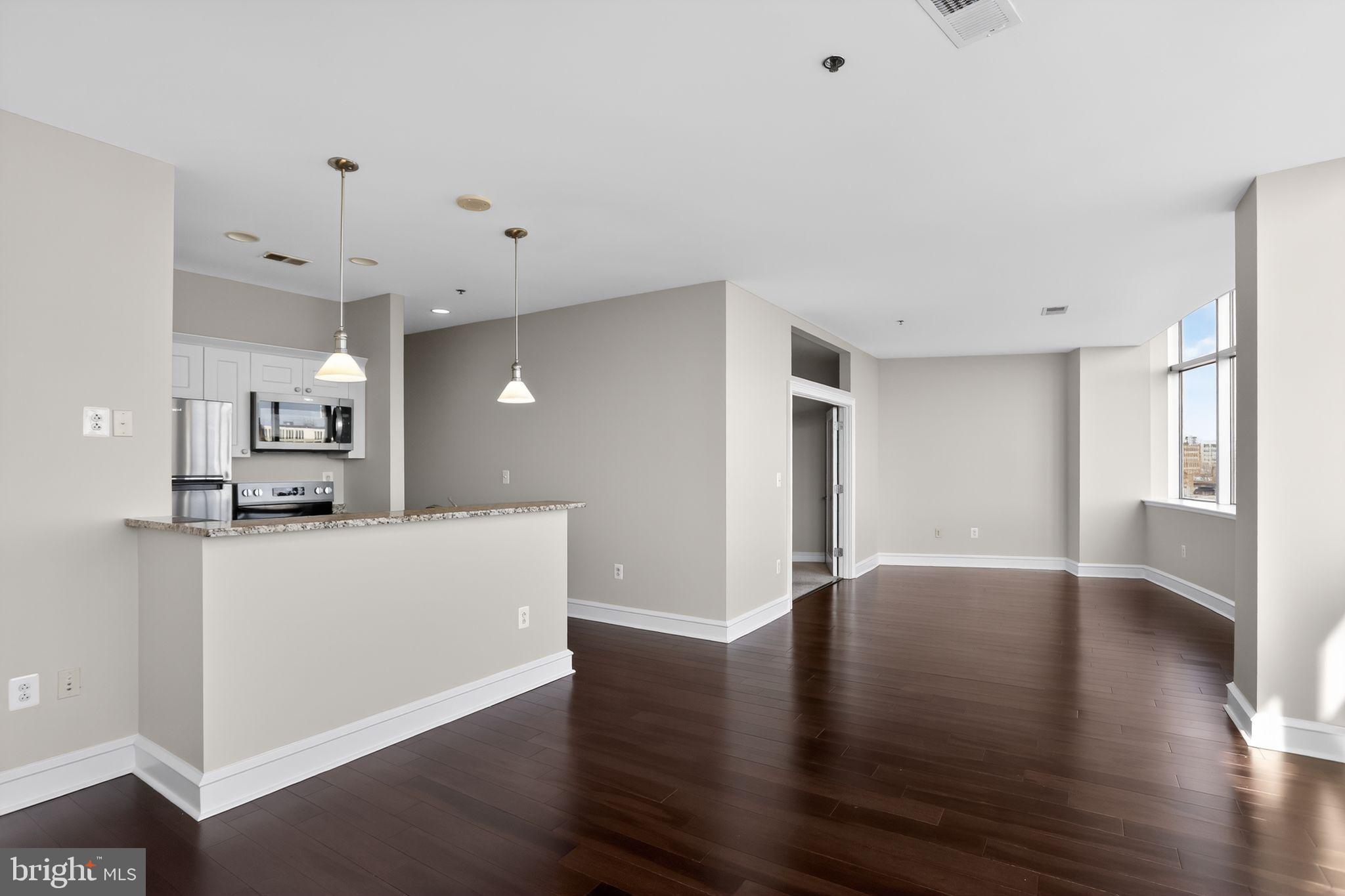 Skyline views. Deeded parking. Resort-style amenities. Welcome to Metro Club.

This move-in ready, 1-bedroom residence offers soaring 13-foot ceilings, espresso hardwood floors, and 10 oversized windows that flood the space with natural light while showcasing views of the Ben Franklin Bridge, Franklin Square, and the Philadelphia skyline. Motorized shades add convenience and privacy at the touch of a button.

The open-concept living and dining area provides flexible space for relaxing, working from home, or entertaining guests. The updated kitchen features granite countertops, white cabinetry, a full-size pantry, and brand-new stainless steel appliances including a refrigerator, oven, dishwasher, and microwave.

The spacious bedroom includes brand-new carpeting and walk-in closet, while the marble-tiled bathroom is finished with elegant Carrara marble. Additional upgrades include a new washer and dryer, new hot water heater, and a separate laundry/storage room for added convenience.

A rare opportunity in Old City: deeded parking in a secure gated lot is included with the sale.

Metro Club residents enjoy 24-hour concierge service, on-site maintenance, a fitness center, bike storage, Amazon package lockers, updated common areas, and a fully updated heated pool and hot tub. The building is pet-friendly with no additional pet fee.

Perfectly positioned between Old City and Center City, you're just steps from restaurants, coffee shops, historic landmarks, shopping, nightlife, hospitals, and major employers. Commuters will appreciate the Franklin Square PATCO Station directly across the street, nearby SEPTA access, and convenient connections to I-95, I-676, and New Jersey.

An excellent primary residence, pied-à-terre, or investment opportunity. Even better, the current special assessment is being paid in full by the seller.