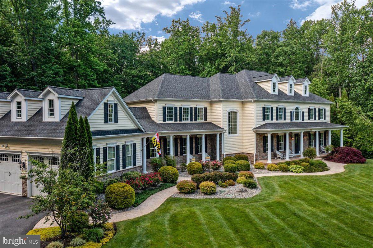 Welcome to 860 Governor Bridge Road!  A stunning craftsman style estate home enclosed on a private 2.5 acre gated parcel.  Master craftsmanship, dramatic two-story ceilings, elegant moldings, and tasteful fixtures await!  If you are ready to love where you live year-round, this home offers a billiard room, home gym, private theater room, a refreshing saltwater pool (heated for those chilly nights) with waterfall and hot tub!  You will not be disappointed!  Impressive 2 story main foyer entrance welcomes you to this generous open layout.  Walls of windows, high ceilings, and rich hardwood flooring set the tone for luxury and opulence.  The kitchen is the true heart of this home.  Custom cabinetry, chef appliances, and timeless granite provide a great workspace to create your favorite dishes!  Everything you need for a true gourmet cooking experience.  Enjoy a quiet evening in the music room, or entertain your favorite guests in the large living room with gas fireplace overlooking the pool and gardens.  Quick meals on the go are a breeze in the casual breakfast room.  The formal dining room is ready host your largest dinner parties.  Holiday memories are ready to be made in this elegant room.  Full scale home office on main level compliments your busy lifestyle while affording a quiet workspace and much needed convenience.  Automation smart house system is at your fingertips controlling alarm, gate, pool, etc.  A mud room with built-in cubbies make organization easy!  The primary suite is it’s own private oasis.  Romantic ceiling, coffee station with wine fridge, and a gas fireplace.  You will never want to leave!  Custom built dual walk-in closet is a showstopper!  The private bath has stunning hand-picked Italian tiles, arched ceilings, spa inspired whirlpool tub and steam shower, and separate vanities.  The upstairs bedrooms, 3 en-suite, are expansive and complemented with large closets. All baths have beautiful fixtures, hand selected tiles, and sleek vanity tops.  Above the garage is a fabulous studio suite with a bedroom and den area and full bath.  This is perfect for guests or a nanny!  The finished walk-out basement has full daylight.  Large family room with gas fireplace.  2nd kitchen with granite counters, stainless appliances, recessed lighting, and island complimented with a generous dining space.  Additional large bedroom with full  bathroom. This is the perfect space for multi-generational living, au-pair, guests, etc.  It's all about lifestyle!  There is an additional laundry room and bathroom with outside access – perfect for the pool.  Step outside onto the screened-in composite deck and enjoy evening sunsets and morning coffee overlooking the gardens picturesque views.  A 4th fireplace is thoughtfully placed so you can enjoy cozy evenings.  Multiple tiered decking creates numerous spaces for outdoor lifestyles. Pavers patio is perfect for evening gatherings and roasting smores.   Parking is never an issue. Oversized 3-car garage ensures an open driveway for friends and family.  Celebrate the warm weather ahead and start new traditions with friends and family in this beautiful estate, which awaits to be filled with your treasures. Welcome home.