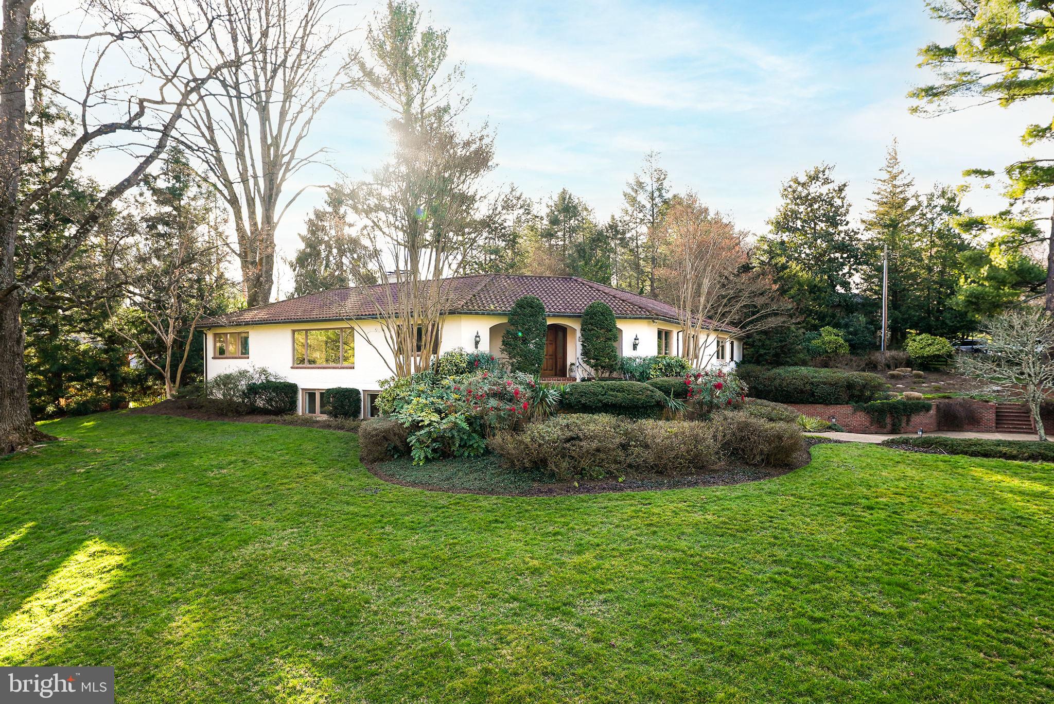 Welcome to this beautiful one-of-a-kind home, situated on an expansive corner lot in the Malbrook neighborhood, offering stunning curb appeal and a welcoming circular driveway tucked away with a two-car garage and electric privacy gate. This home is centrally located close to schools, Lake Barcroft, restaurants like Criosho, and the famous Peking Gourmet Inn, and it also offers commuter convenience with easy access to downtown DC, Tysons Corner, National Landing, and local airports. 

This expanded floor plan boasts gracious living and entertaining potential with its traditional layout that flows seamlessly from room to room through the enlarged doorways. The sizable living room with large picture windows overlooking the front yard is filled with natural light and touches the formal dining room that leads to the eat-in kitchen. The kitchen comes complete with a subzero fridge, dual ovens, an island, and seamless countertops extending to a breakfast bar. The kitchen is bright and tranquil, with views of the backyard through the wall-to-wall sliding door windows. The main level also features a family room with vaulted ceilings and skylights, a study, an updated powder bathroom, and a den with a wet bar that offers stunning pure wood accents. Outstanding details include custom Pella windows, arched doors throughout the home, and custom ironwork indoors and out by Stokes of England. 

Enjoy the convenience of entry-level bedrooms, where you will find a sizeable primary bedroom with his and hers ensuite bathrooms that were recently redone and perfected by Porcelanosa that could also be split and converted to a private ensuite bathroom to service one of the additional two generously sized bedrooms.  Rounding out this level is a 4th large bedroom converted into a walk-in closet with custom closet systems and a full bathroom. 

The ground level features a bonus recreation room with built-ins, making a great office space, a laundry room, a 5th bedroom perfect for guests, a full bathroom, and additional storage space. Expansion is also possible in the unfinished areas on the lower level of both wings of the house. The rear of the house offers a large brick patio with many different seating options, perfect for alfresco dining, and a beautifully landscaped backyard that is tree-lined, offering optimal privacy.  The expansive .88-acre lot has an in-ground sprinkler system, a tile roof, copper gutters, and downspouts.