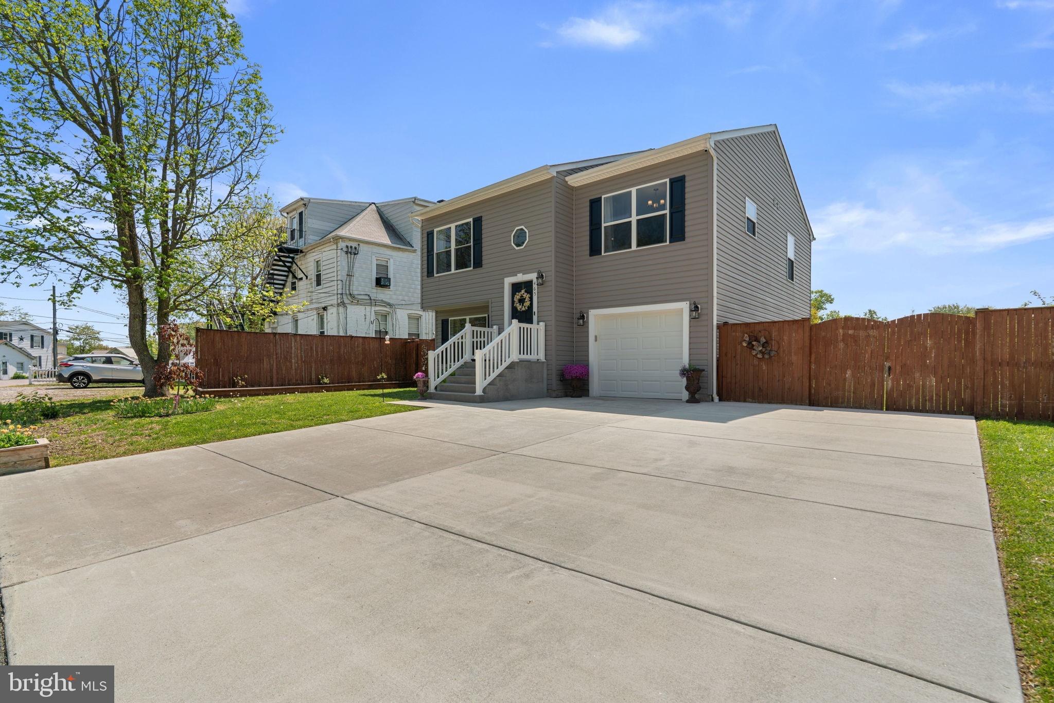 Built in 2016, 465 Carvel Beach Road offers the perfect blend of modern comfort, flexible living space, and outdoor enjoyment in a convenient location close to Fort Meade, Annapolis, and BWI Airport. This beautifully maintained 4-bedroom, 2.5-bath single-family home features an attached garage, thoughtfully designed living spaces, and an incredible outdoor setup ready to enjoy from day one.

The upper level features a bright and open living space with vaulted ceilings and a spacious eat-in kitchen complete with granite countertops and stainless steel appliances. The primary suite offers vaulted ceilings and a private en-suite bath, complemented by two additional bedrooms and a full hall bath. The lower level adds even more flexibility with a fourth bedroom, half bath, dedicated full-size laundry room, and additional living space ideal for a media room, home office, or play area.

Step outside to enjoy a fully fenced, spacious yard designed for both relaxation and entertaining. A gardener’s dream, the property already includes raised garden beds and a beautifully landscaped yard creating a private and functional outdoor retreat. Recent outdoor upgrades include a back patio off the lower level and a stone fire pit area perfect for gatherings. The front double-gate fence provides exceptional access and flexibility, with enough space to accommodate even an RV, boat, or additional vehicles.

Need additional parking? No problem! Ample parking on the driveway and garage completes the package. NO HOA! A rare opportunity at an exceptional value! Currently the only 4-bedroom single-family home in Anne Arundel County built within the past 10 years and offered under $525,000. Don’t miss your chance to own this incredible home. Schedule your tour today!