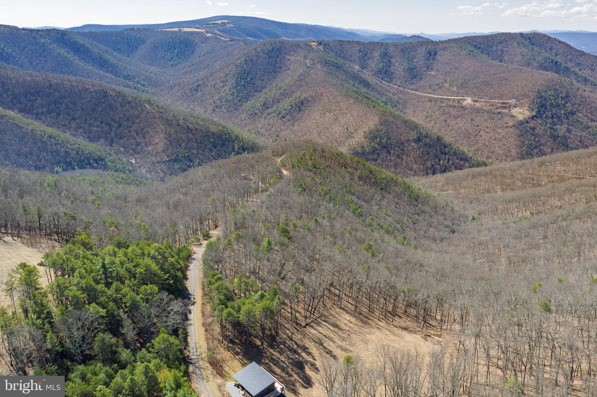 Escape to the beauty and tranquility of the mountains with this exceptional 11.09-acre buildable lot located in the desirable Potomac Valley Overlook community of Hardy County, West Virginia. Offered at $75,000, this private homesite presents a rare opportunity to create your custom mountain retreat, vacation getaway, or full-time residence surrounded by some of the region’s most breathtaking natural scenery.

Nestled among rolling ridges and mature woodlands, the property offers the ideal balance of seclusion, serenity, and outdoor adventure. Potomac Valley Overlook is known for its expansive acreage parcels, peaceful atmosphere, and stunning panoramic views. Potomac Valley Overlook bordering the renowned George Washington National Forest, the community provides direct access to endless opportunities for hiking, wildlife watching, camping, fishing, and exploring the beauty of the Appalachian Mountains.

Whether you envision a modern mountain cabin, luxury retreat, or rustic escape, this versatile property offers the perfect setting to bring your vision to life. Enjoy crisp mountain air, star-filled night skies, and the privacy that only West Virginia mountain living can provide.

The terrain offers an authentic mountain experience, and while accessible, a 4-wheel-drive vehicle is highly recommended for navigating the community roads comfortably throughout the seasons. This added sense of adventure only enhances the charm and exclusivity of the location.

Conveniently situated within driving distance of local shops, restaurants, and outdoor recreation, this property allows you to enjoy both peaceful retreat and practical accessibility. Discover the unmatched beauty of Hardy County and experience elevated mountain living at Potomac Valley Overlook.