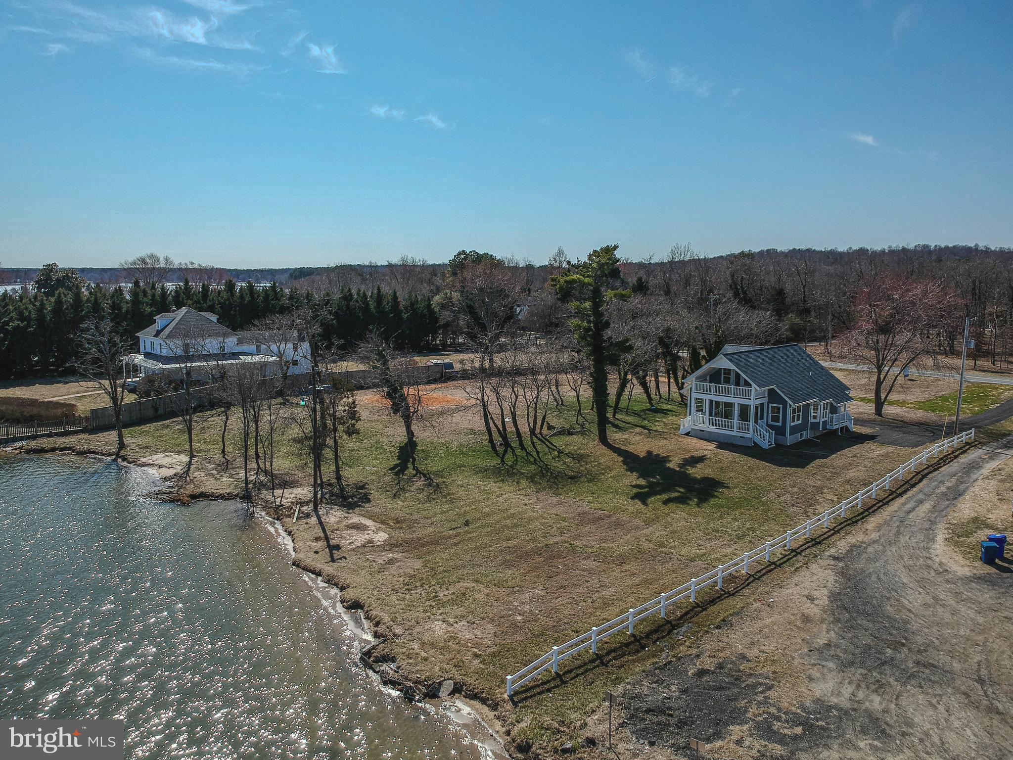 Own One of the Largest Waterfront Lots in Benedict w/ Unobstructed Views of the Patuxent River: 4 Bedroom/3 Bath 2-Story Waterfront Situated on 1.79 Acres +/- in Quaint Waterfront Community of Benedict in Charles County.  Downstairs Offers an Open Floor Plan Concept in the Front of the House with Water Views in Every Direction and Two (2) Bedrooms Facing Mill Creek Road. Upstairs You Will Find an Oversized Bedroom with French Doors Leading to a Second Floor Porch Overlooking the River as well as One Full Bathroom and an Additional Bedroom/Office/Sitting Room. Entertain or Relax Enjoying the Picturesque Views of the Patuxent River from the 1st or 2nd Floor Porches Off the Front of the House or the Expansive Yard that Leads to a Sandy Beach.  Potential to Subdivide Lot in the Future, if Public Sewer Comes to Benedict.