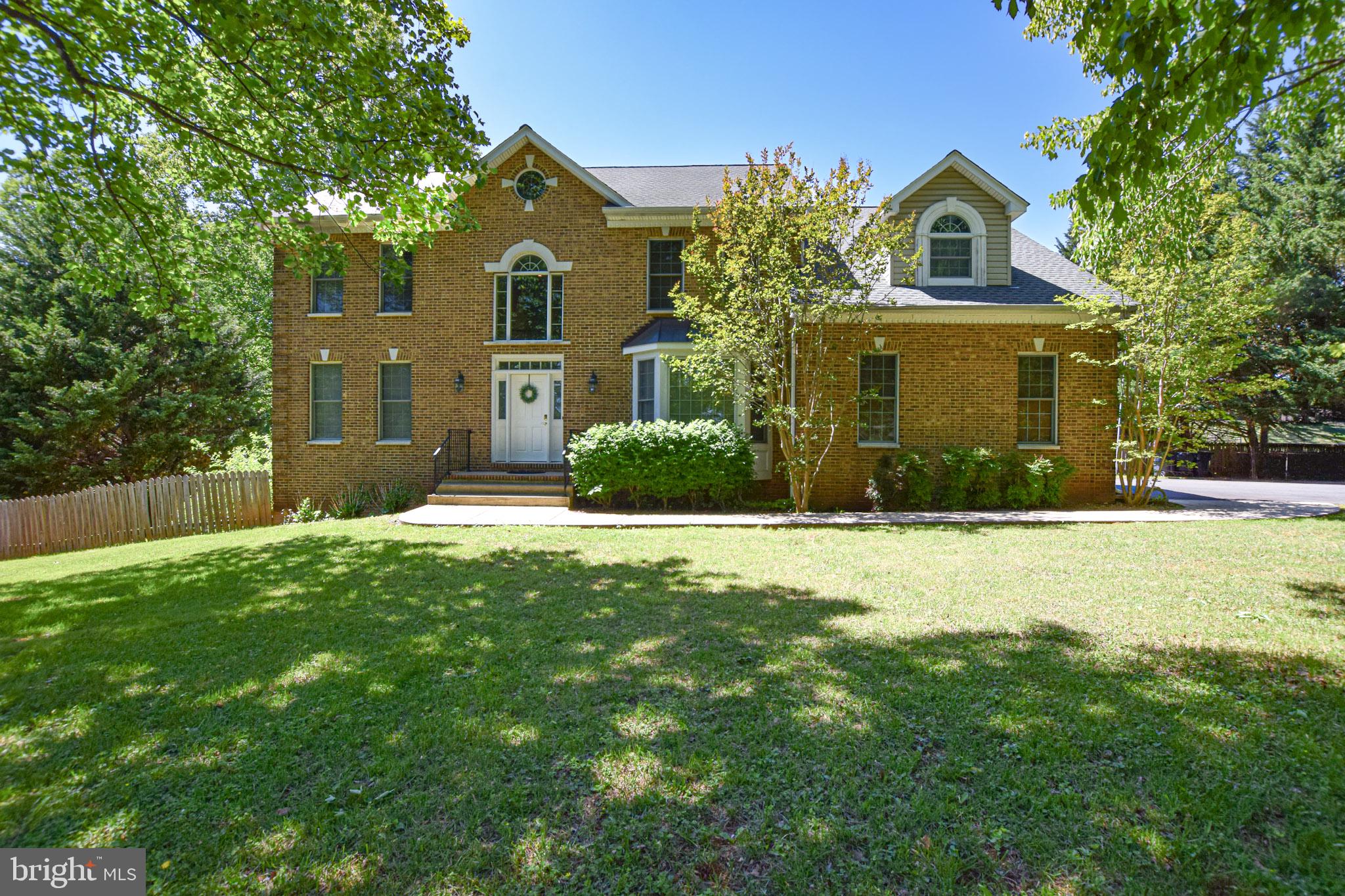Prepare to be WOWED by all that this colonial style house has to offer. Perfectly situated within highly sought after Crescent Hills Estates is this 4-bed, 4.5-bath home, gracefully set on 1.32 acres. A grand two-story foyer with a catwalk welcomes you into bright, open living spaces, including a formal living room and an elegant dining room ideal for entertaining. Conveniently located off of the family room is the eat-in kitchen which serves as the heart of the home, offering a comfortable gathering space for everyday living. On the main level you will also find a dedicated private office, enhanced with custom built-in shelving, providing a quiet and functional workspace. The second level is dedicated to all four bedrooms as well as a Jack and Jill bathroom and two additional full bathrooms. The spacious primary suite is a true retreat highlighted by vaulted ceilings, hardwood flooring a luxurious ensuite bathroom with a large soaking tub, a beautifully tiled walk-in shower, and a double vanity. If that isn't enough to want to call this place home, it also features a full walkout basement. The basement offers exceptional potential for recreational space with direct access to a patio and fully fenced backyard. This home offers a rare combination of space and privacy in a well-established neighborhood where mature trees and landscaped surroundings create a peaceful, inviting atmosphere year-round.