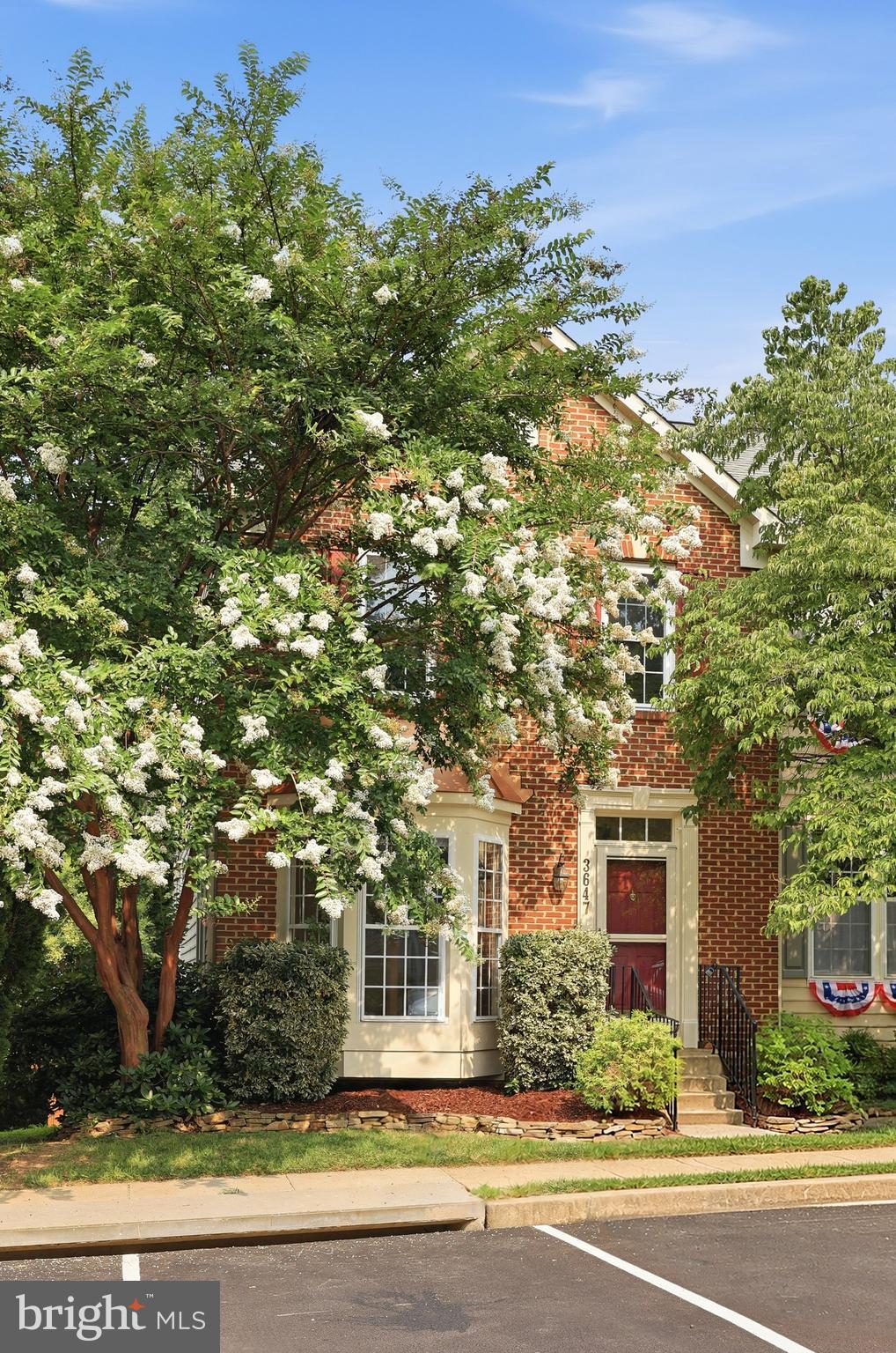 Welcome home to this beautifully maintained townhome in a premium wooded setting in the highly sought-after Villages of Urbana! Backing to peaceful trees and featuring an oversized fenced backyard, spacious deck, and patio, this home offers the perfect blend of privacy and outdoor living.

Step inside to a bright, open floor plan designed for both everyday living and entertaining. The spacious living room flows effortlessly into the kitchen, complete with stainless steel appliances, a center island, breakfast nook, and a sunny morning room featuring a cozy gas fireplace and French doors that open to the deck. Newly refinished hardwood floors add warmth and elegance throughout the main level.

Upstairs, retreat to the luxurious owner's suite with a relaxing sitting area, walk-in closet, and beautifully updated en-suite bath. Two additional generously sized bedrooms and a full hall bath complete the upper level.

The finished walk-out lower level offers an enormous recreation room filled with natural light, a full bath, and a versatile bonus room that's perfect for a home office, gym, guest room, or playroom.

This home is loaded with valuable updates, including a new roof (2026), new HVAC (2023), hot water heater (2020), fresh upstairs carpet (2025), bedroom windows (2021), and all appliances replaced within the last four years, including the washer and dryer (2026) and more!.

All of this is located in the award-winning Villages of Urbana, where you'll enjoy resort-style amenities including multiple pools, clubhouses, fitness centers, walking trails, parks, tennis and pickleball courts, top-rated schools, and convenient shopping and dining. This is the one you've been waiting for—move right in and start enjoying everything this incredible home and community have to offer!