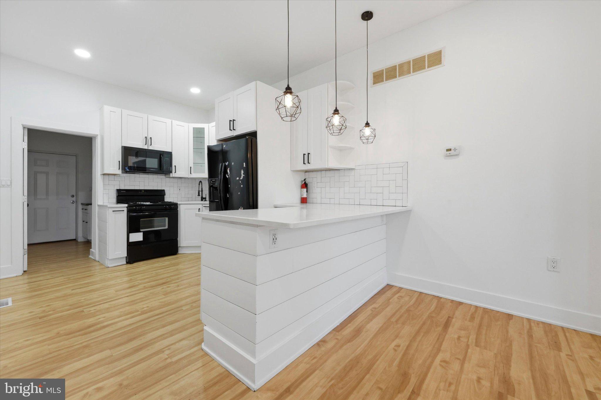 Fully renovated in 2022 end-row home, completely move-in ready and perfect for a primary residence in a growing neighborhood. First floor features a modern kitchen, half bath, and laundry area with access to a private backyard. Second floor offers 3 bedrooms and a renovated full bath. Finished basement provides additional living space. End unit offers extra natural light and privacy. Turnkey condition—just move in and enjoy.