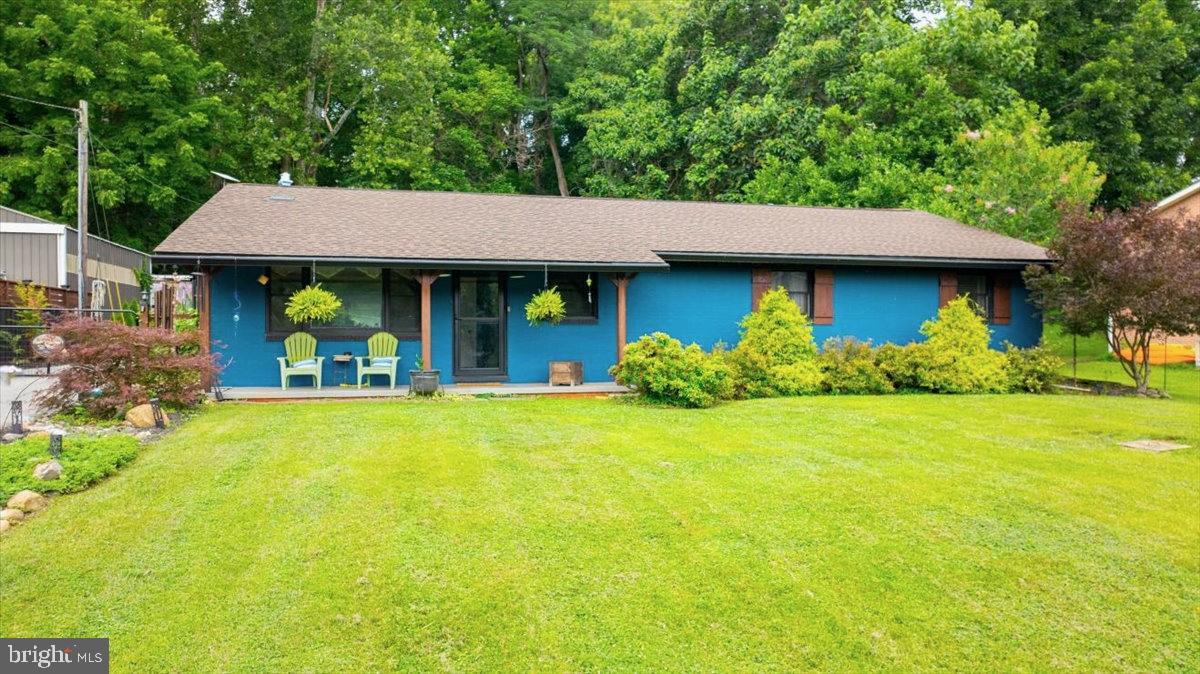 Love waterfront living, this unique property is for you! The Glen Haven community sits just minutes from the Maryland and Virginia borders, on a pristine 9 miles+/- of Deep Water Potomac River.  Not only does the community have a well maintained boat launch and pavilion rentable for large gatherings, but you have your own deep water river lot right down from your beautiful ranch style home with personal dock to park your pontoon, jet skies, ski boat, fishing boat, or kayaks.  The fishing is great on this stretch of river featuring small mouth bass, catfish, and musky.    One of the many unique features of this home is just the way it makes you feel after a long day at work, coming home to peace and serenity, quiet and calm, and just a place to unwind.  

The ranch style home is on a slab allowing you the peace of mind knowing there is no crawl space or basement to worry about if this is not your permanent home.  Recent renovations include kitchen, primary bedroom and bath, hall bath, and new HVAC just last year.  The large kitchen and dining area open to a slate patio out back with hot tub in place to enjoy the house year round.  The driveway has a gate at the top and offers secure parking in the rear.  The home was designed to be a lock and go type of property offering the security you need if not using it as the current sellers did, their primary residence.  

The home sits on .66 acres outside the floodplain and has a 30' wide river lot just down Natalie Lane on the river with your boat dock.  For large gatherings, the river lot sits very close (1 river lot away) to the community common space, pavilion, and private concrete boat ramp controlled by the HOA.