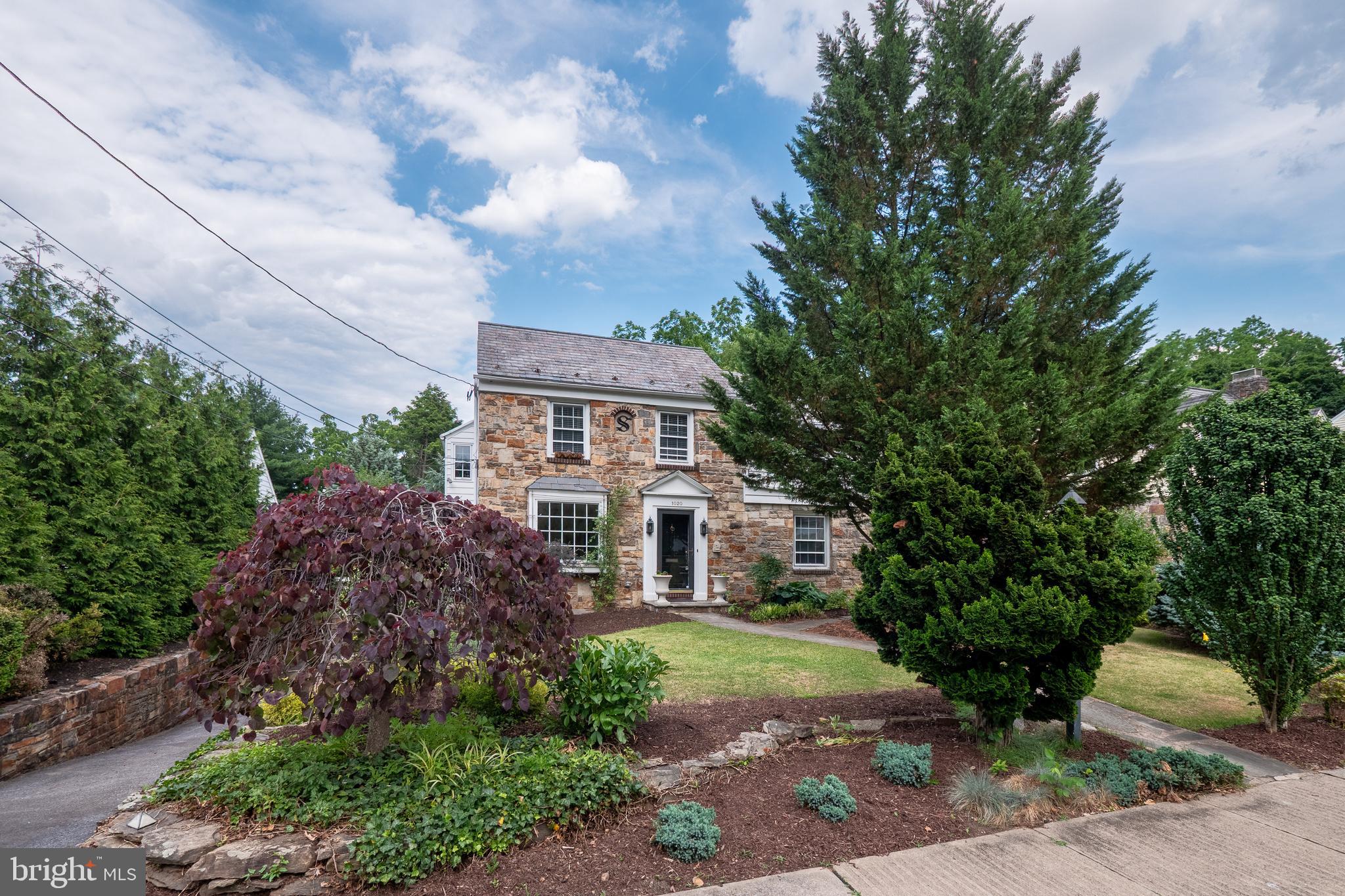 Welcome home to this BEAUTIFULLY updated 1940 DUTCH COLONIAL in the highly sought-after ROSEMONT neighborhood of Bethlehem. This TIMELESS home blends CLASSIC character with MODERN updates with FOUR spacious bedrooms and TWO and HALF bathrooms, featuring all NEW FLOORING throughout the first level and beautifully REMODELED BATHROOMS. The THOUGHTFUL renovations preserve the home's TRADITIONAL CHARM with a COZY WOOD-BURNING fireplace in the formal living room, an INVITING formal dining room for entertaining, a CASUAL breakfast room open to the BRIGHT and SPACIOUS family room perfect for comfortable everyday living. Upstairs the primary bedroom is filled with NATURAL LIGHT and newly renovated en-suite bath. Three additional AMPLE sized bedrooms with plenty of storage, in-home office or den and a full hall bathroom complete the second level. Step outside to a beautifully landscaped backyard that feels like an ENCHANTED GARDEN, a private retreat filled with MATURE plantings, COLORFUL blooms, and inviting spaces for RELAXING, ENTERTAINING, or simply enjoying the peaceful surroundings. Located on one of West Bethlehem's most desirable streets, this MOVE-IN READY home is just minutes from HISTORIC DOWNTOWN BETHLEHEM, parks, shopping, dining, and major commuter routes. A rare opportunity to own a classic Rosemont home with modern upgrades