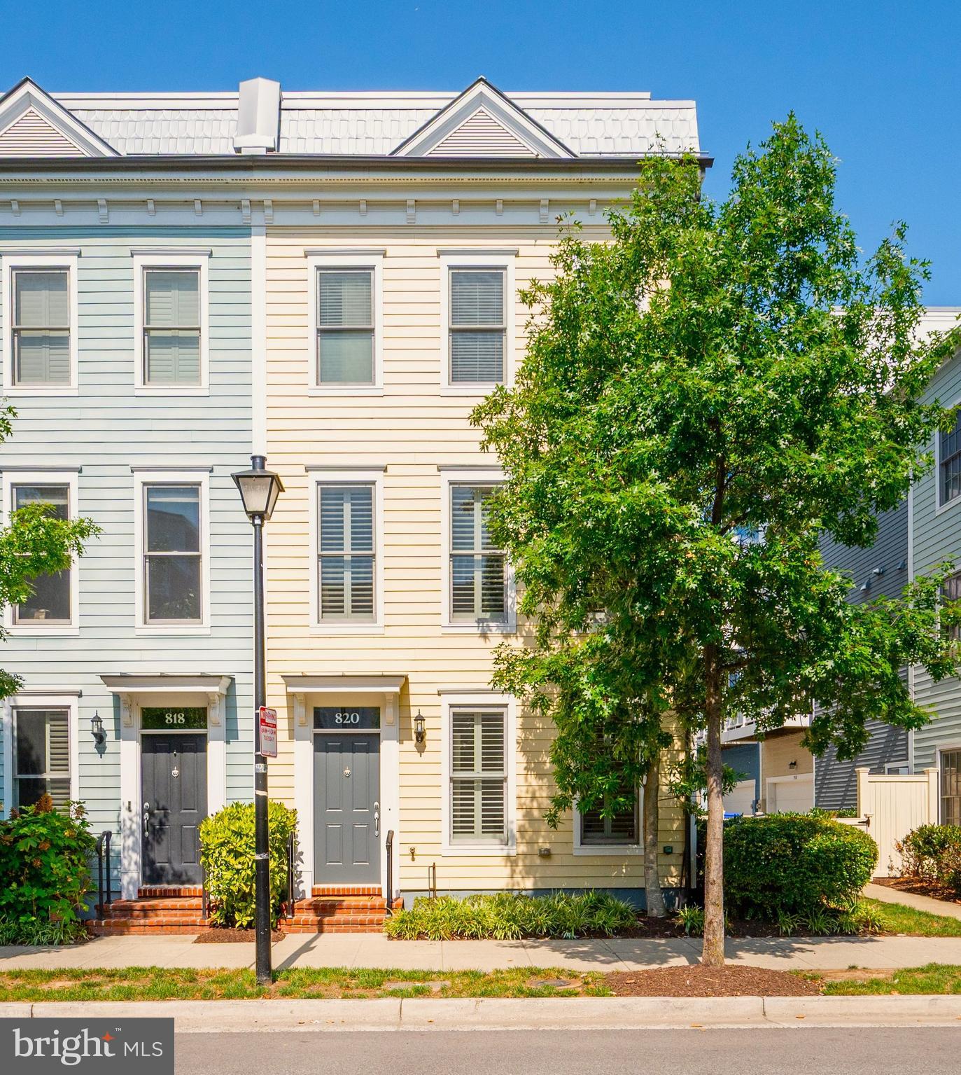 Sunny and bright, this end unit, four-level townhouse at Old Town Commons offers 2,122 square feet of thoughtfully designed living space in the heart of Alexandria. This like-new corner residence features 3 bedrooms, 3.5 bathrooms, an entrance level study that can serve as a 4th bedroom, and a large upper-level family room with a double-sided fireplace that opens to a private rooftop terrace. 
The main level showcases an open plan living and dining area, gleaming hardwood floors, 9-foot ceilings, and a gourmet kitchen with breakfast island, extensive cabinetry, pantry storage, and stainless steel appliances. A rear deck off the kitchen provides additional outdoor space and an ideal location for everyday grilling. Plantation shutters and wood blinds on all windows enhance both privacy and light control, while abundant storage,  ELFA closet systems and Sonos speakers are integrated throughout the home.
The primary suite includes a spacious bathroom with marble shower enclosure, and a fitted walk in closet.  The laundry can be found adjacent to the primary bedroom, together with the second bedroom and ensuite bath. The upper-level family room offers flexible space for entertaining, work, or relaxation, while a third ensuite bedroom provides guests with privacy and independence.   Recent improvements include a new microwave (2024), garbage disposer (2023), refrigerator (2023), washer and dryer (2023). With brand new carpet (2026) and freshly painted throughout (2026), this home is in turnkey condition.   A two-car garage provides secure parking and additional storage and completes this gorgeous property.
Located only four blocks from Braddock Road Metro station, this home offers quick access to regional transit, National Airport and DC. Just eight blocks to the shops and restaurants of King Street, two blocks from Trader Joe's and Harris Teeter, easy walking distance to the river, bike trail, and waterfront parks, this immaculate townhouse offers an enviable mix of modern comfort, functional design, and a prime commuting location.